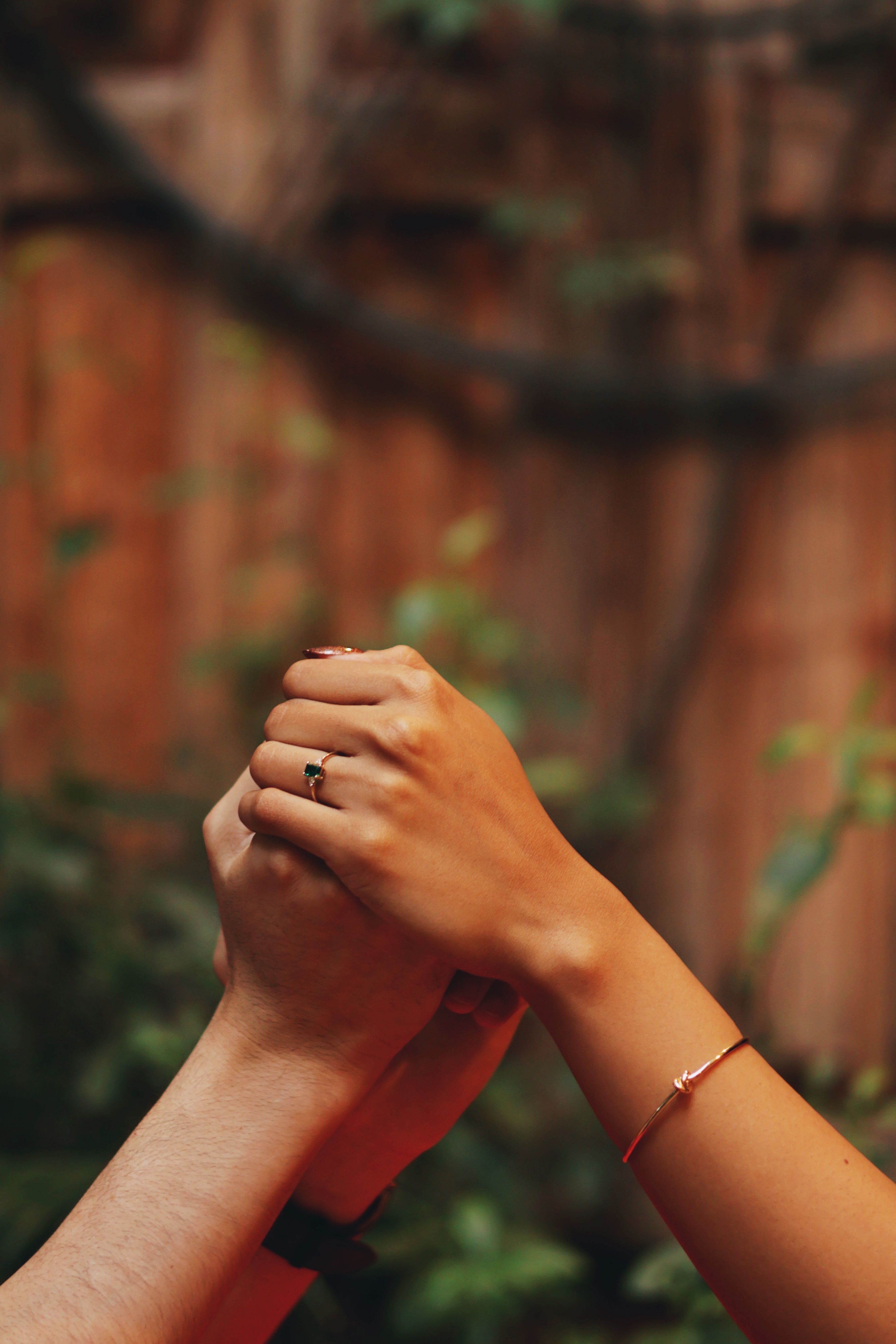 Romantic Couple Holding Hands in Nature · Free Stock Photo