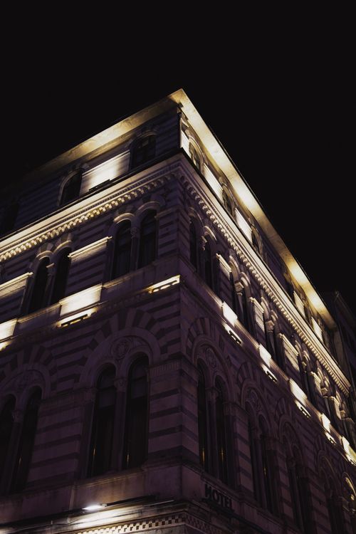 Free A beautifully lit historic building with elegant architecture captured at night. Stock Photo