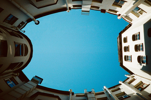 Free A unique architectural view looking up in Saint Petersburg, Russia, with clear blue sky. Stock Photo