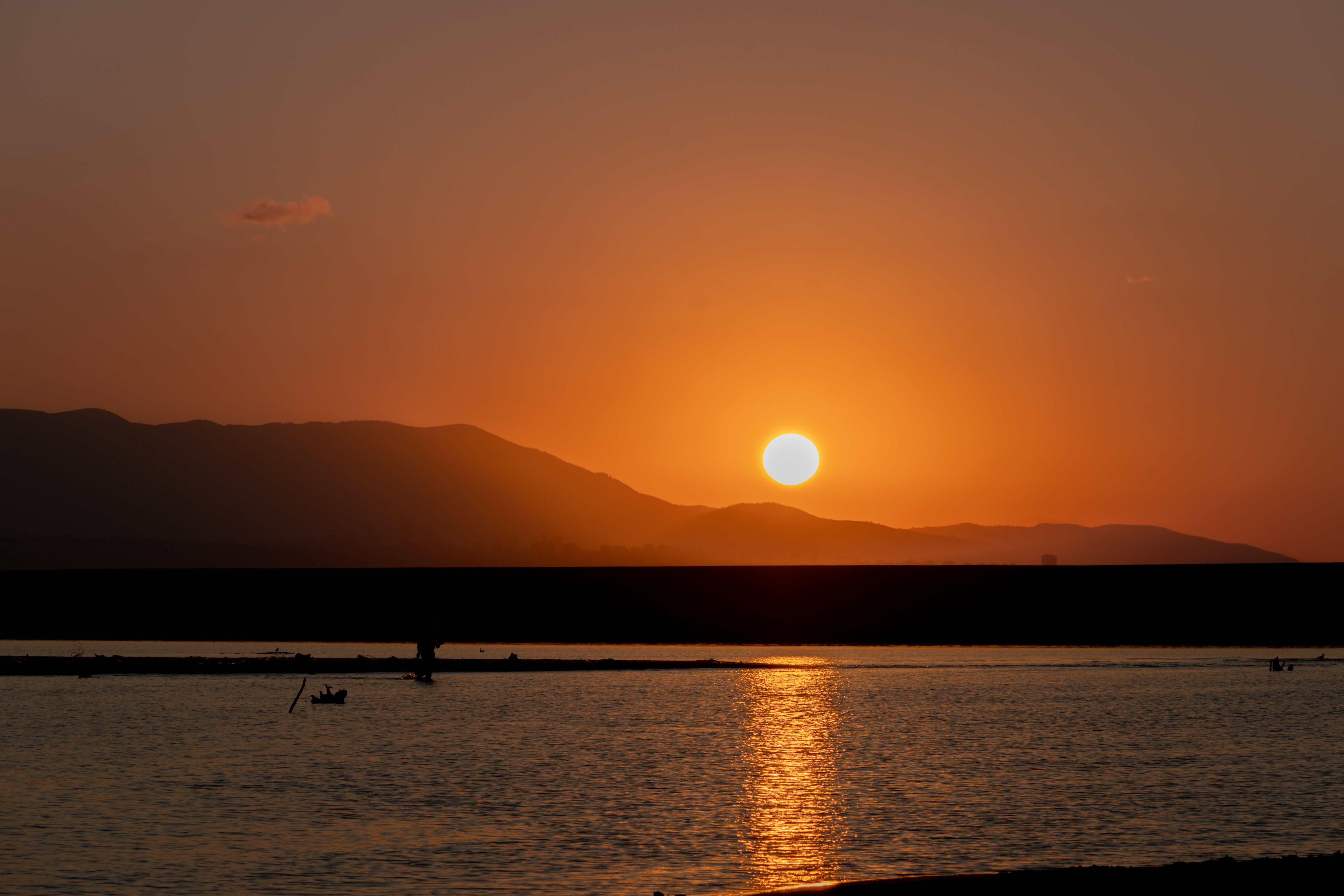 Sun setting behind the West Bank hills across the Nile from Luxor