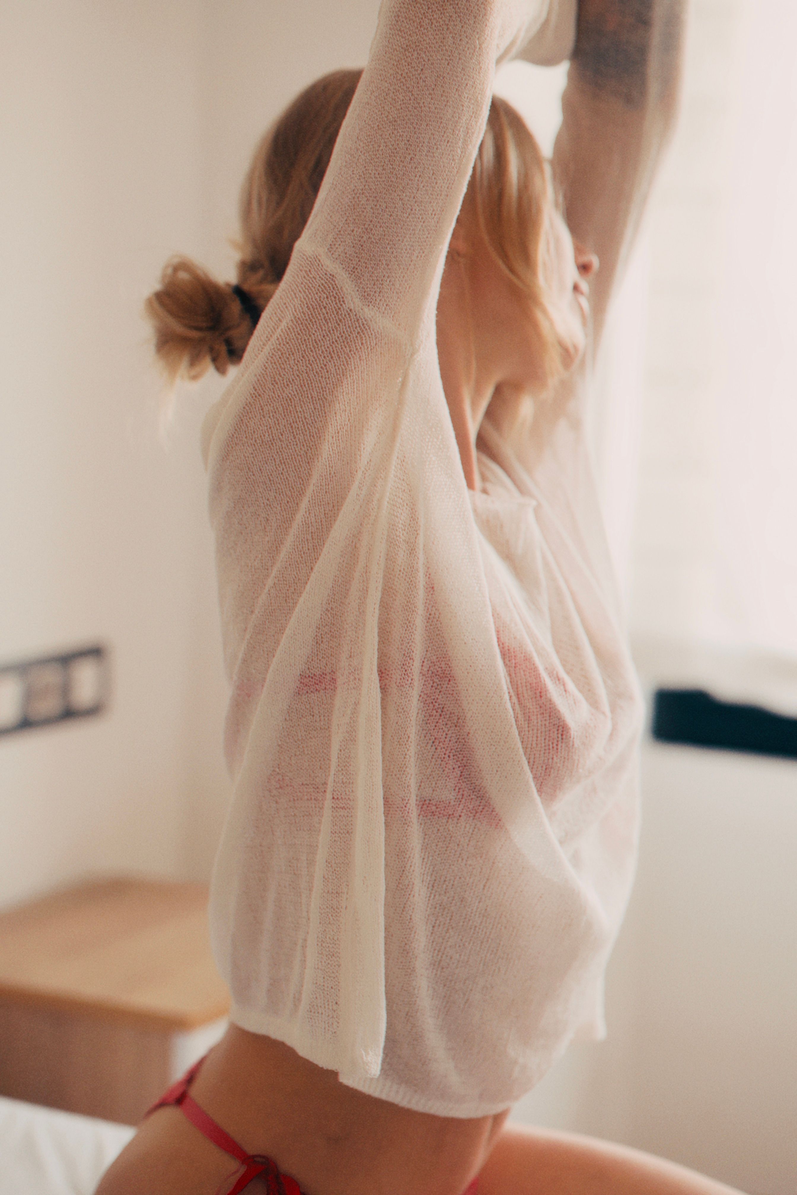 Relaxed Indoor Portrait of Woman Stretching