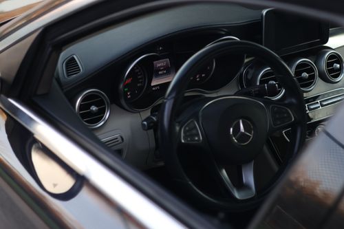 Free Close-up of a luxury car's interior showcasing modern dashboard and steering wheel. Stock Photo