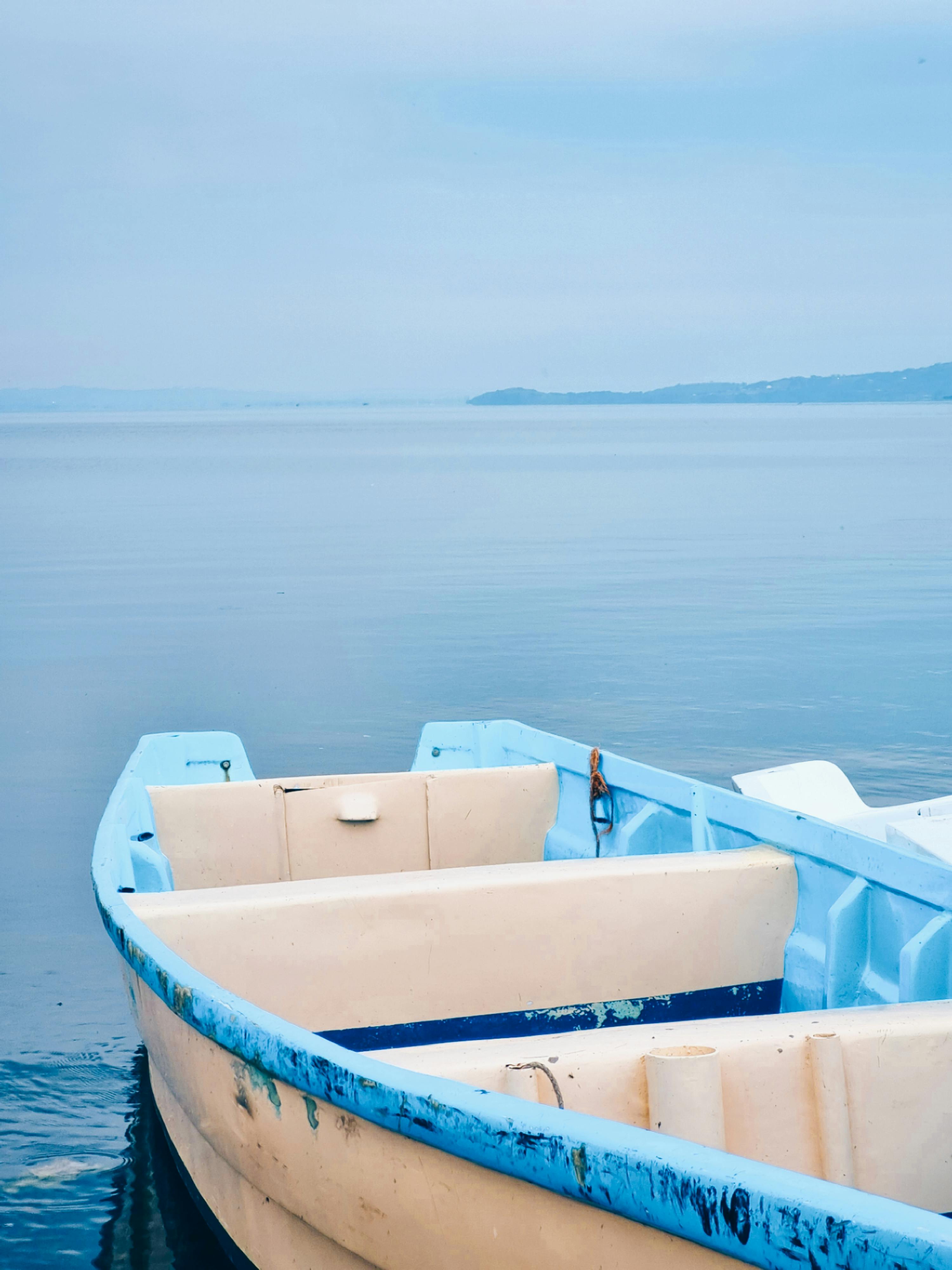 Peaceful view of a boat on Lake Victoria in Homa Bay, Kenya, with serene blue waters.