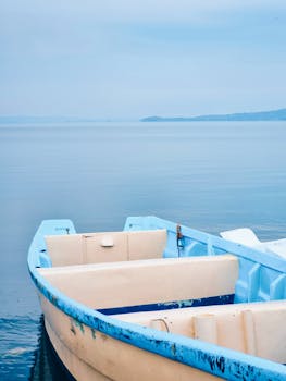 Peaceful view of a boat on Lake Victoria in Homa Bay, Kenya, with serene blue waters.
