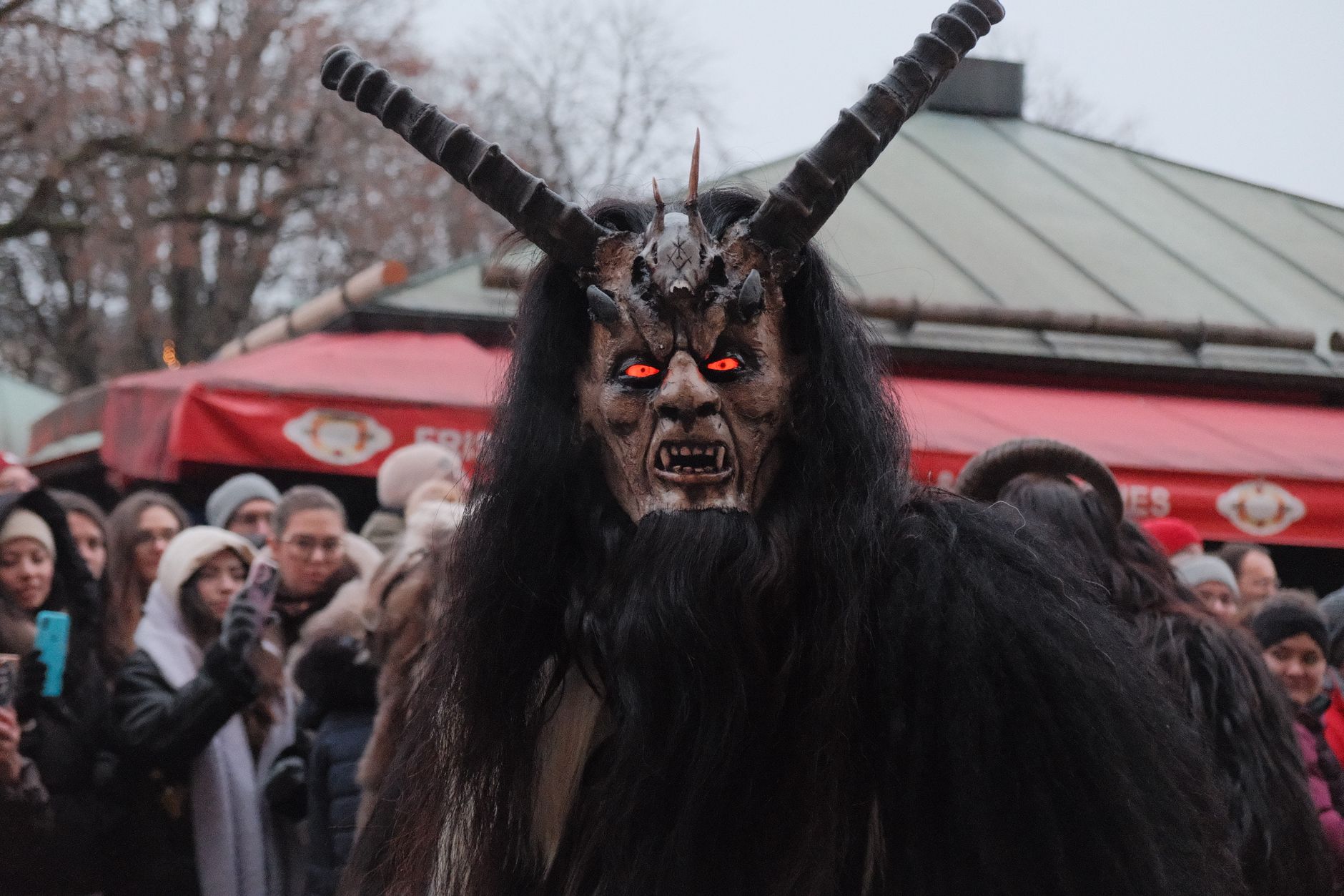 An intimidating Krampus figure during the traditional parade in Munich, Germany.