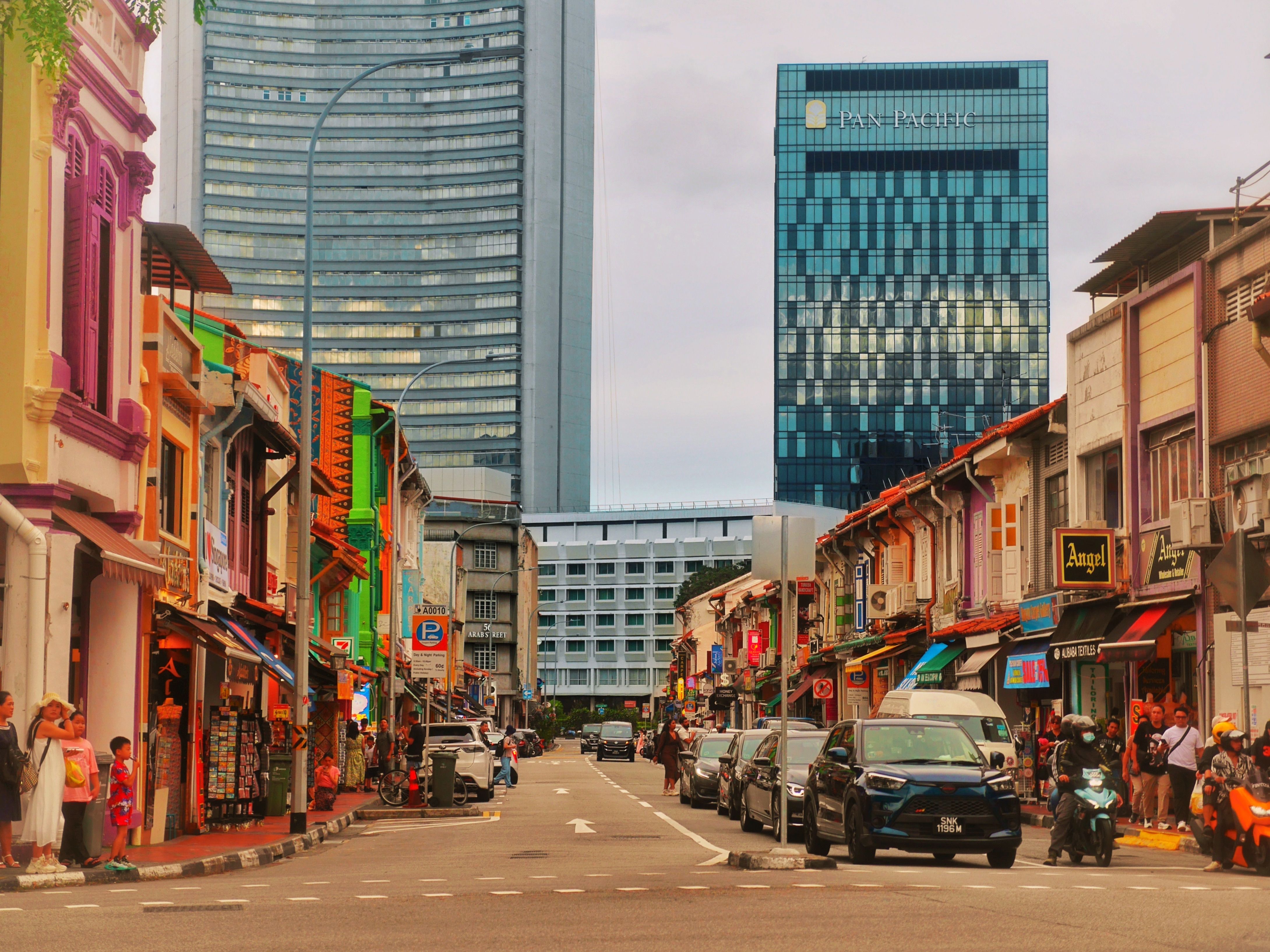 A Grab car driving on a busy street in Singapore