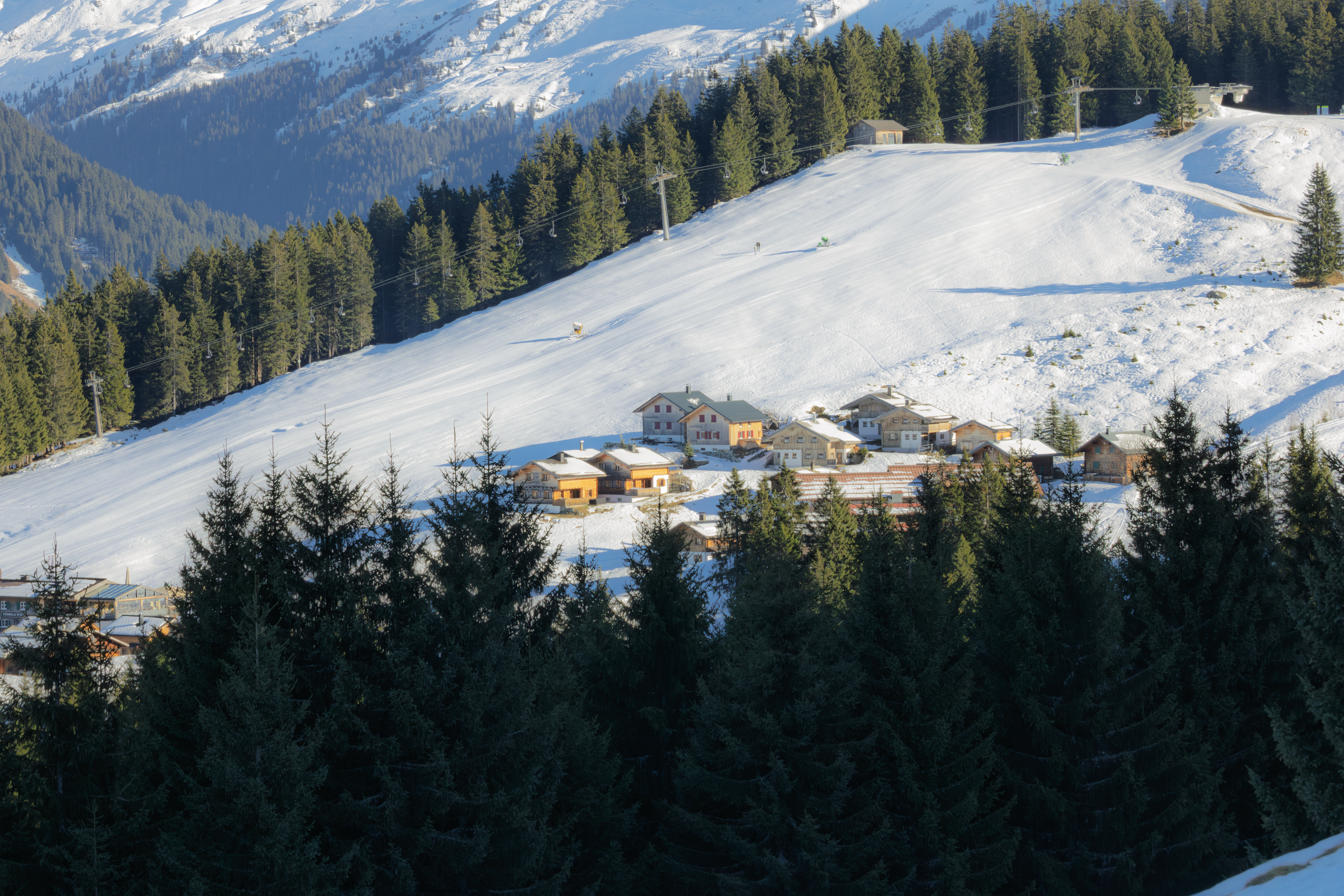 An Alpine village under snow in the Vorarlberg mountains, across the Arlberg
