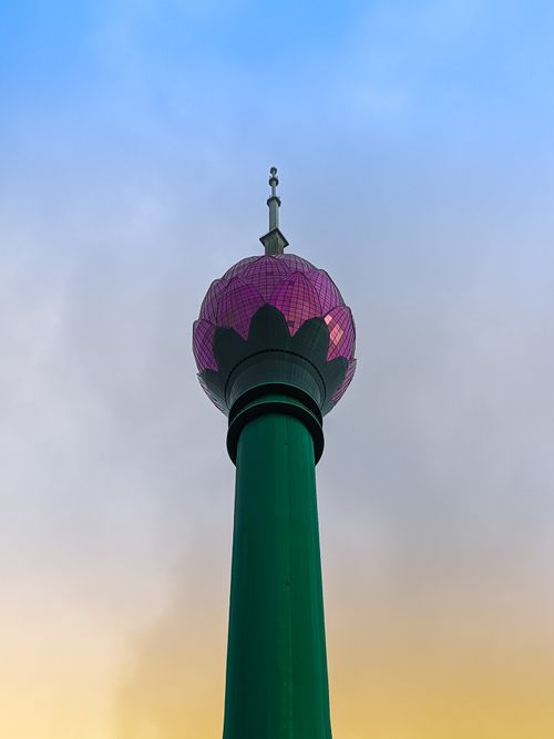 Free The Lotus Tower, Colombo stands tall against a vibrant sunset sky in Sri Lanka. Stock Photo