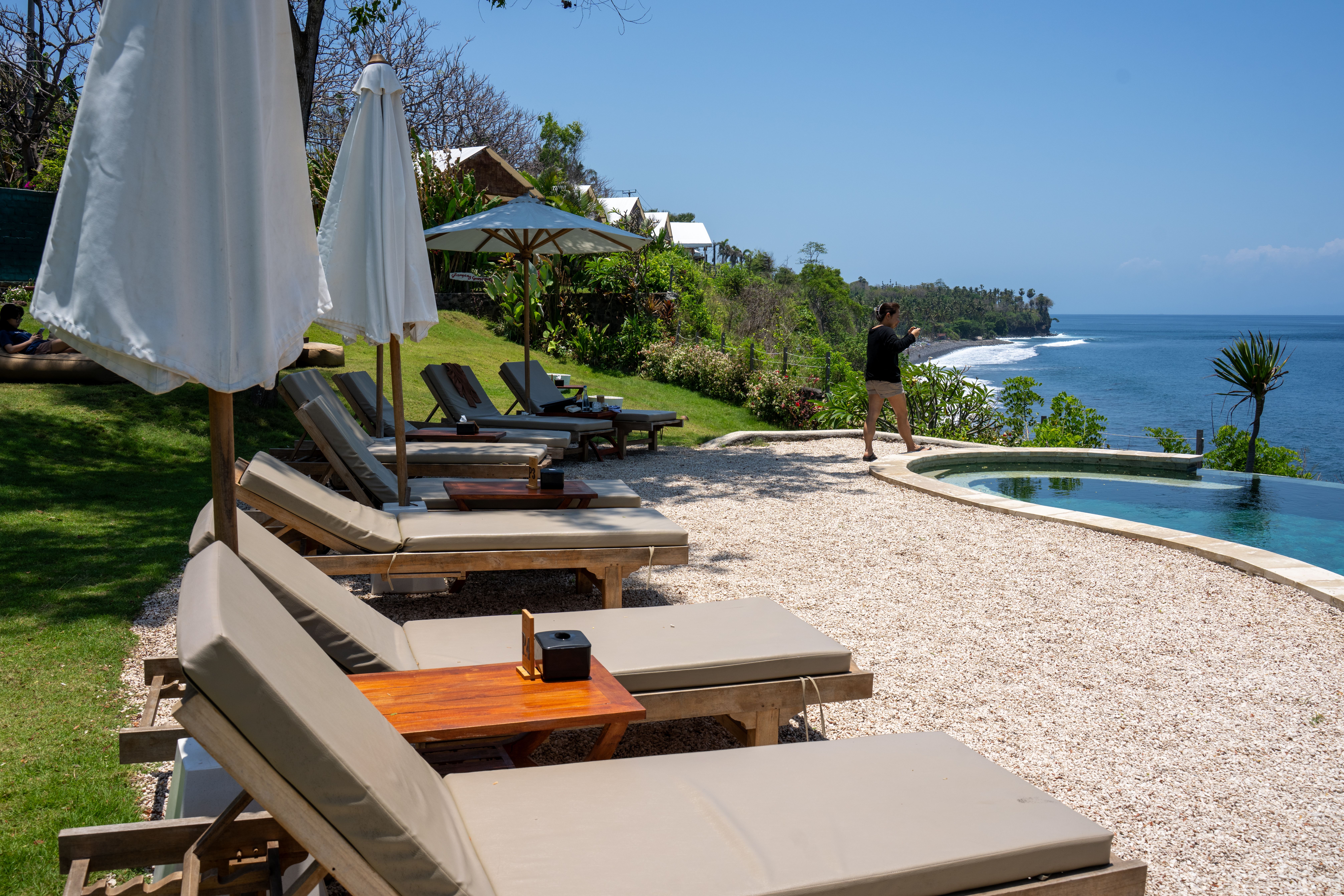 Relax by the pool with stunning ocean views at a Bali resort.