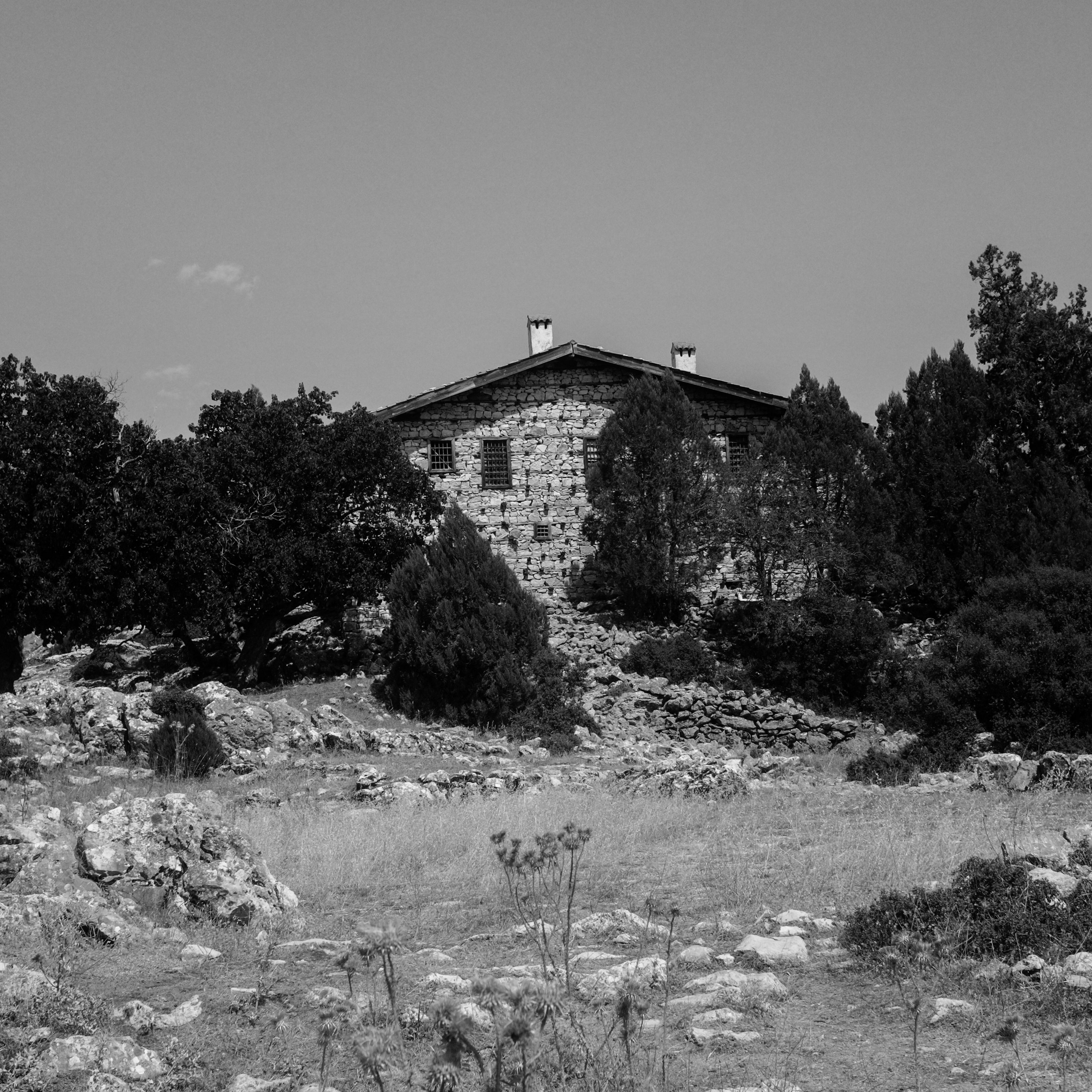 Rustic Stone House in Black and White Landscape · Free Stock Photo