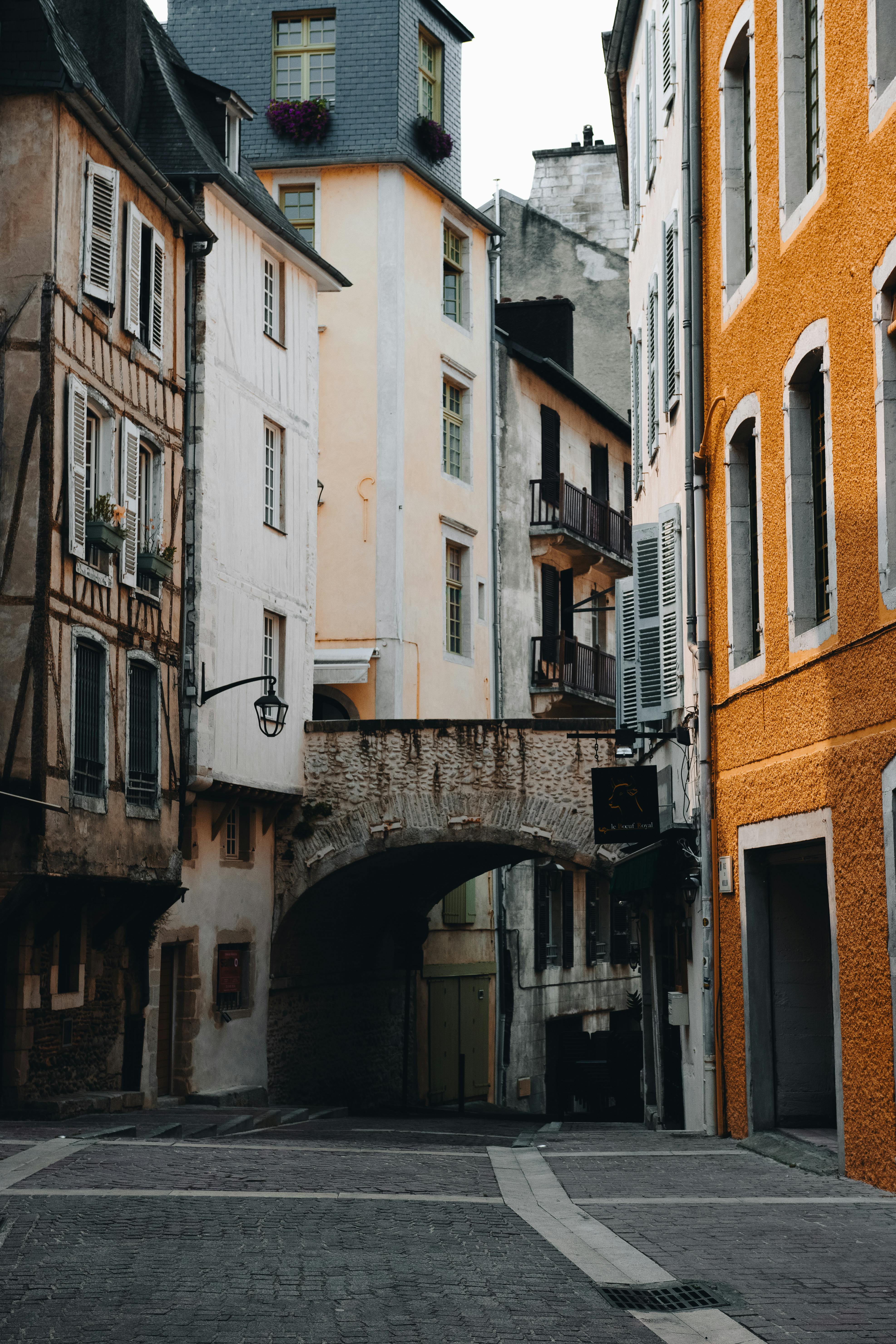 Picturesque view of a narrow historic street in Pau, France, showcasing charming architecture.