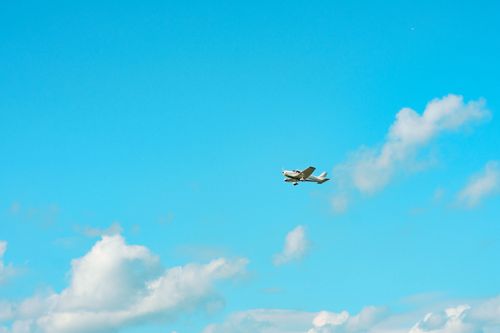 Free A small plane soaring through a clear blue sky over Stratford, Ontario, Canada. Stock Photo