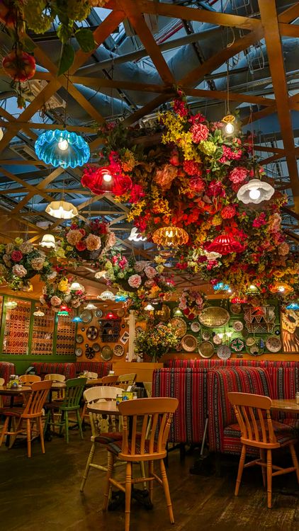 Vibrant Restaurant Interior with Floral Decor · Free Stock Photo