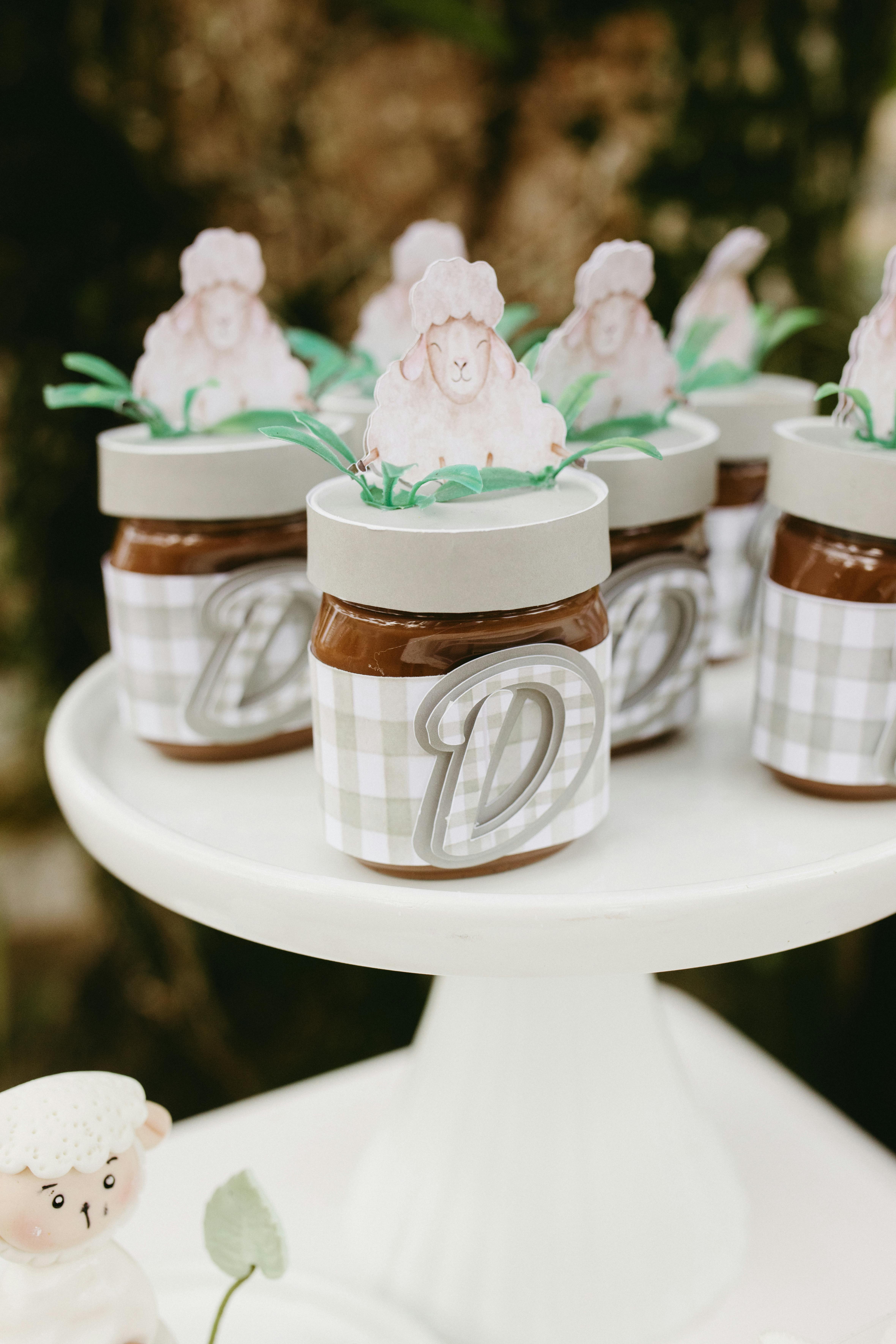 Adorable farm-themed cupcake decorations with sheep toppers, perfect for a child's birthday party.