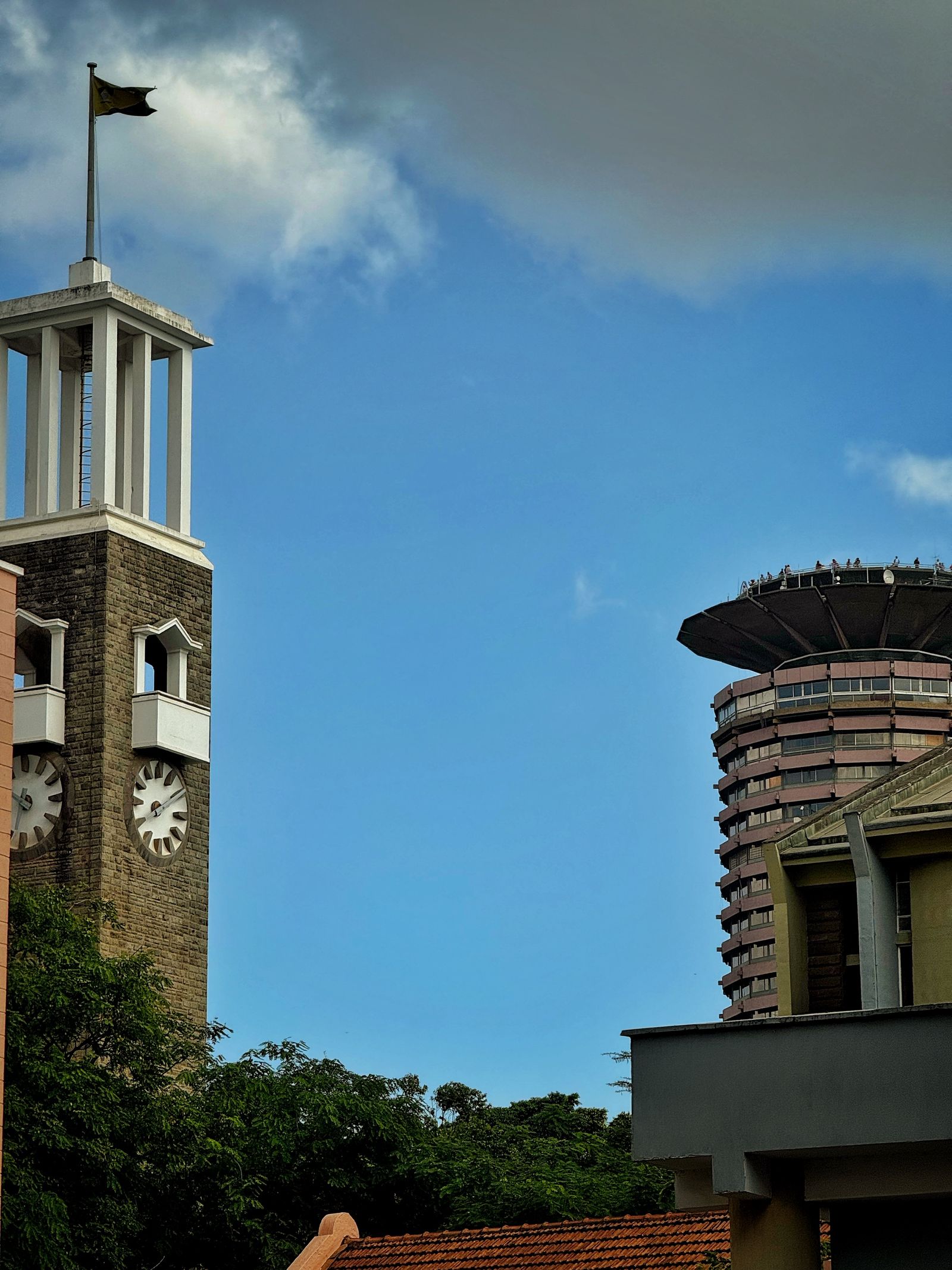 KICC and a historic clock tower in Nairobi CBD under a blue sky