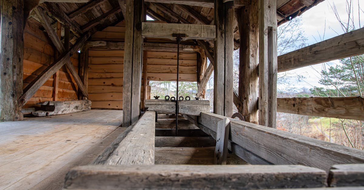 Photo by Andreas Berget A detailed view of a rustic wooden sawmill structure in Norway, showcasing traditional craftsmanship.