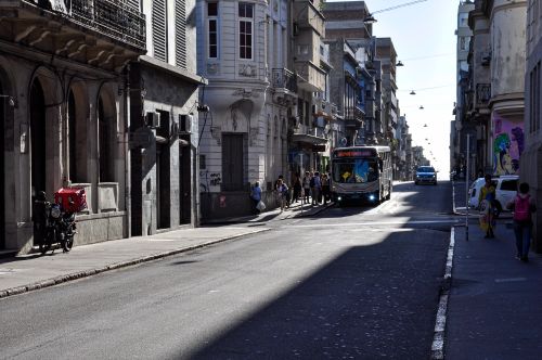 Free Urban street scene with bus and pedestrians in Montevideo, Uruguay, during daytime. Stock Photo