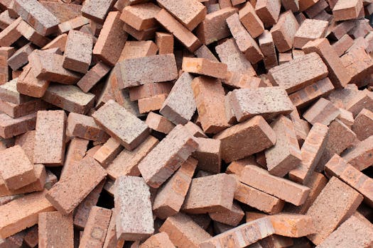 A large pile of red bricks suitable for construction and building projects in Indonesia.