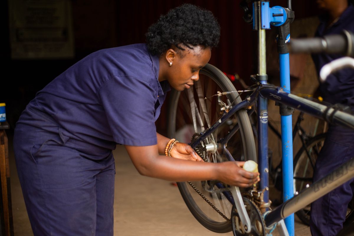 Professional bicycle mechanic using tools during routine maintenance