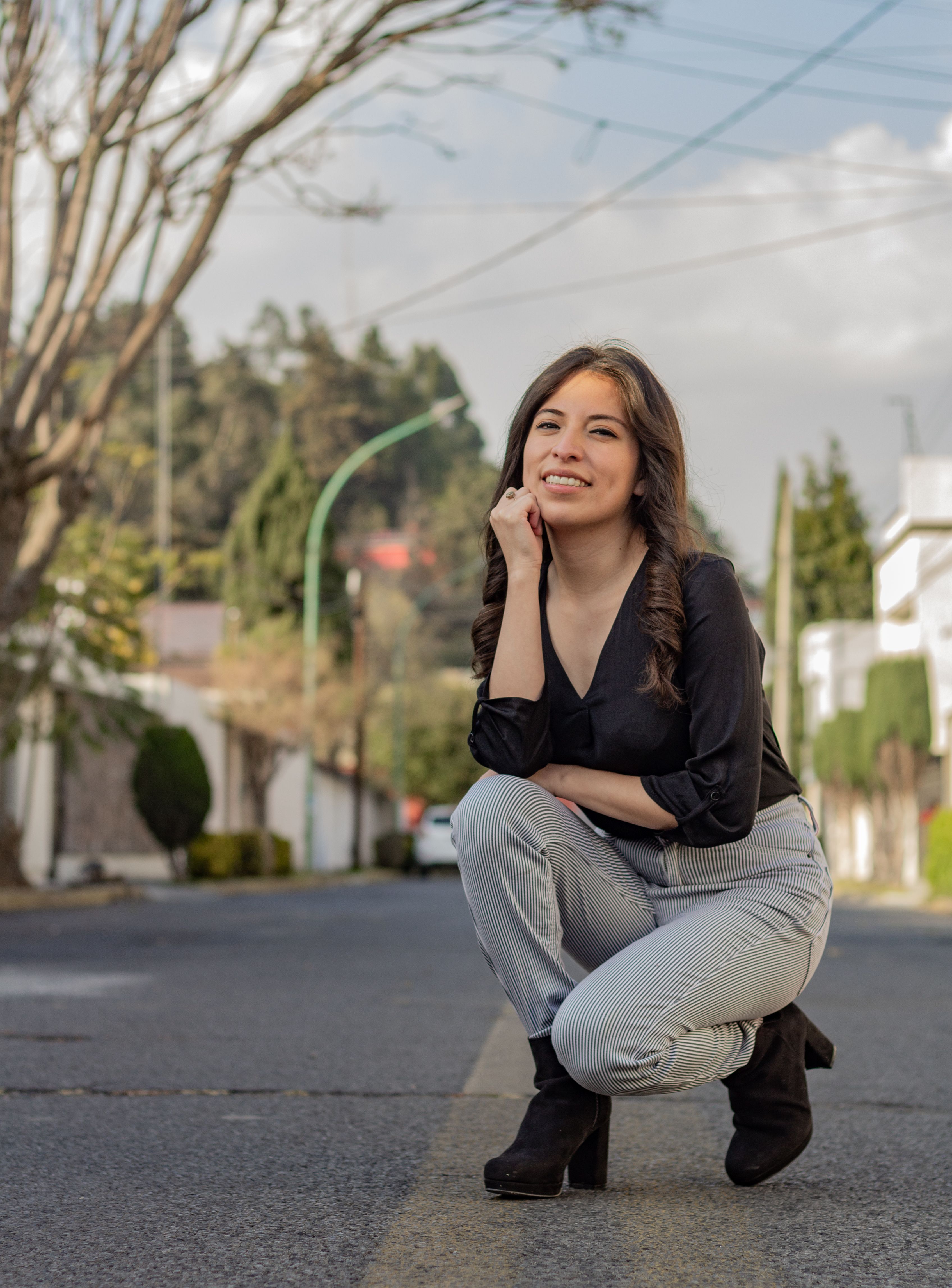 Young Woman Posing Outdoors on a Sunny Day · Free Stock Photo