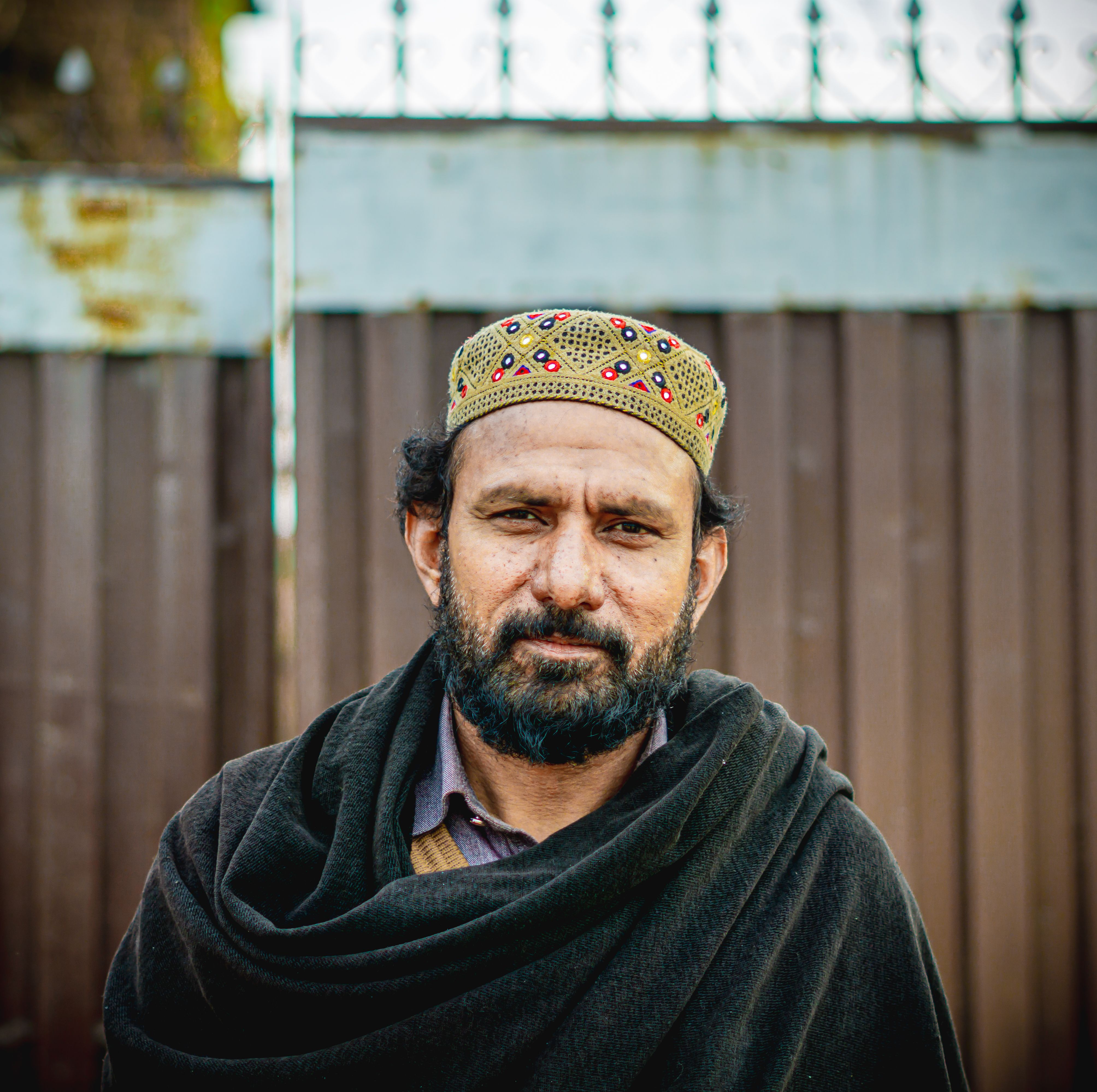 Portrait of a Man in Traditional Cap Outdoors