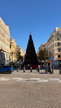 Christmas tree adorned in city center of Marseille, capturing the festive urban atmosphere.