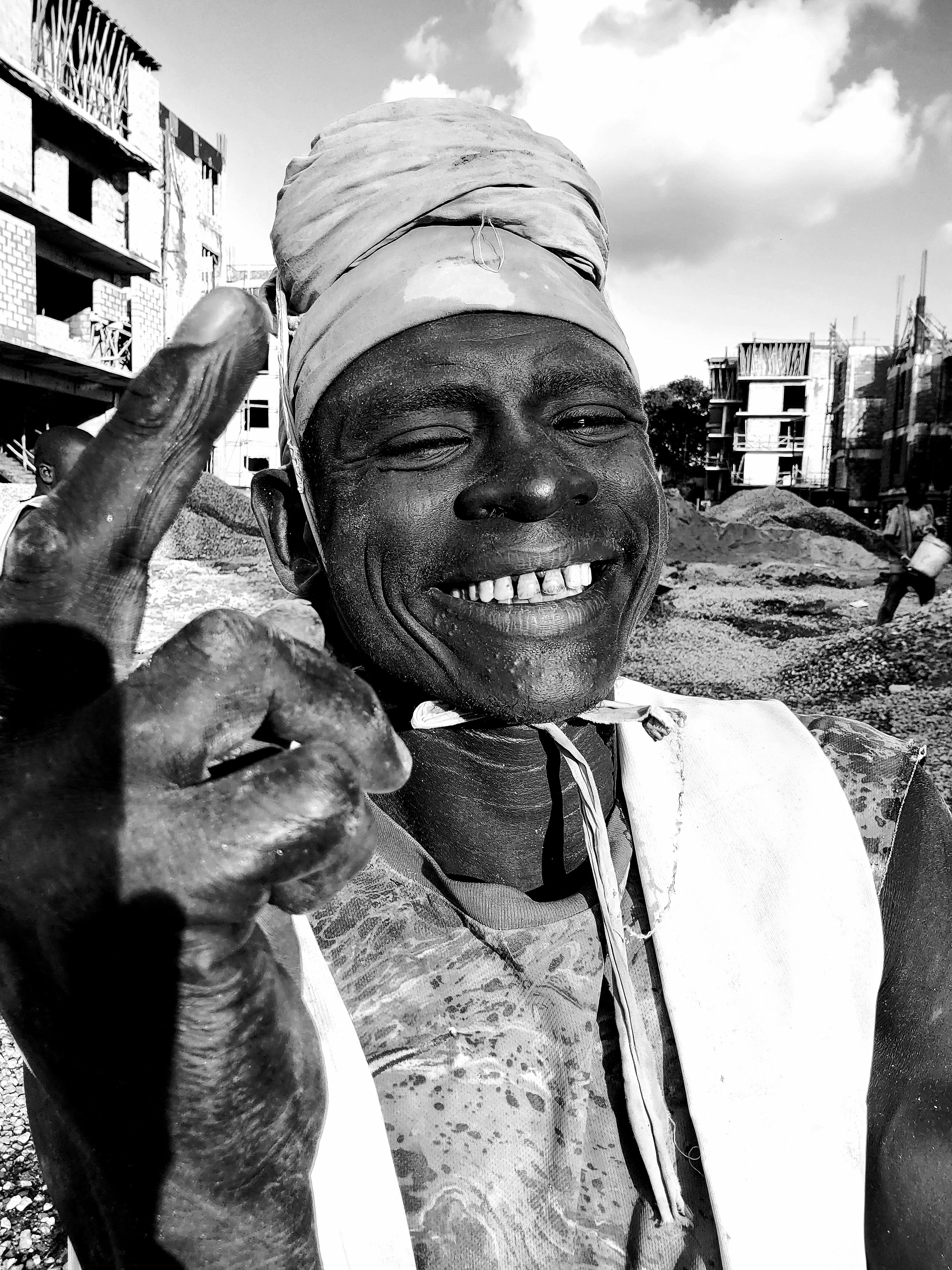 Smiling Construction Worker in Black and White · Free Stock Photo