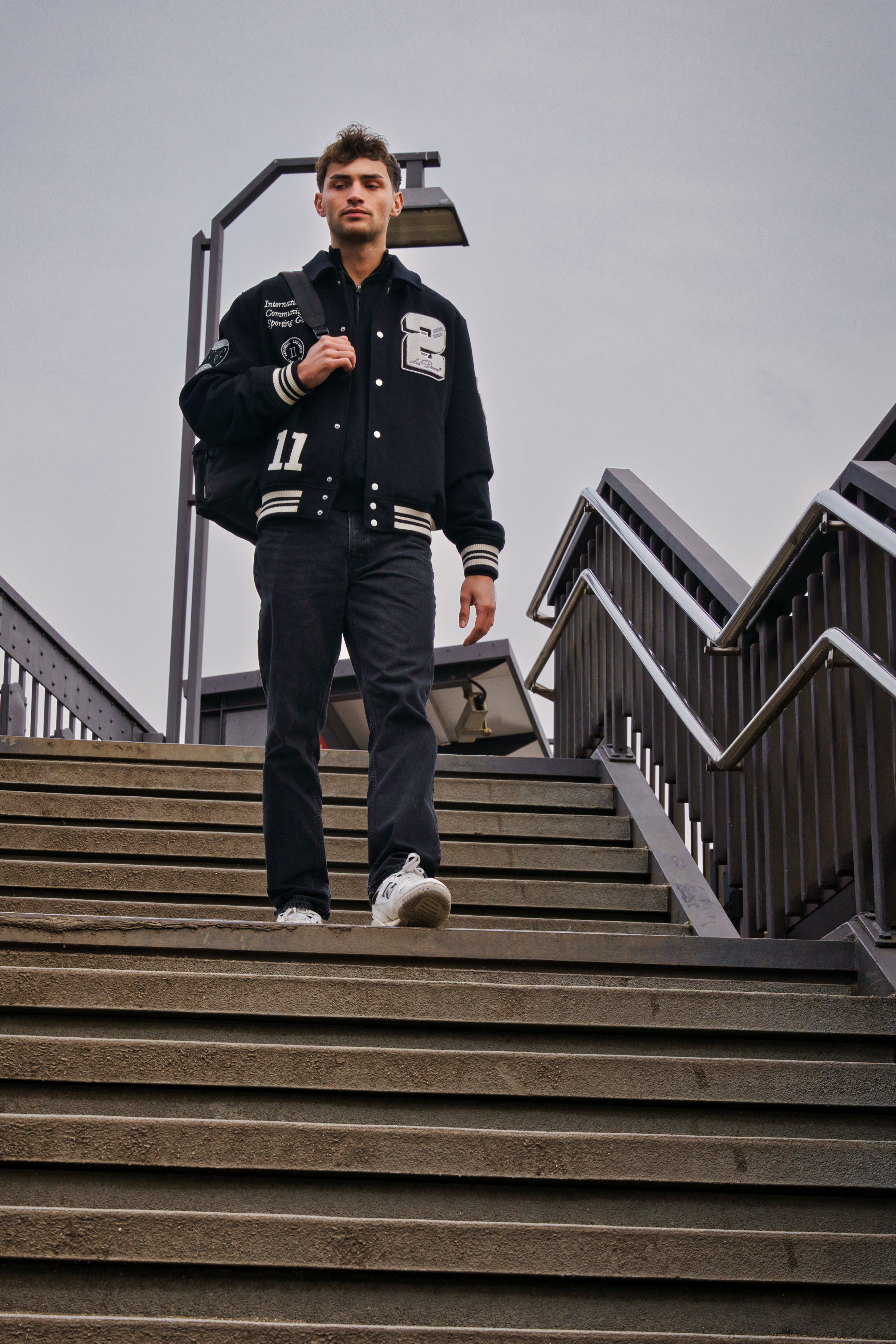 Man Descending Stairs in Urban Setting · Free Stock Photo