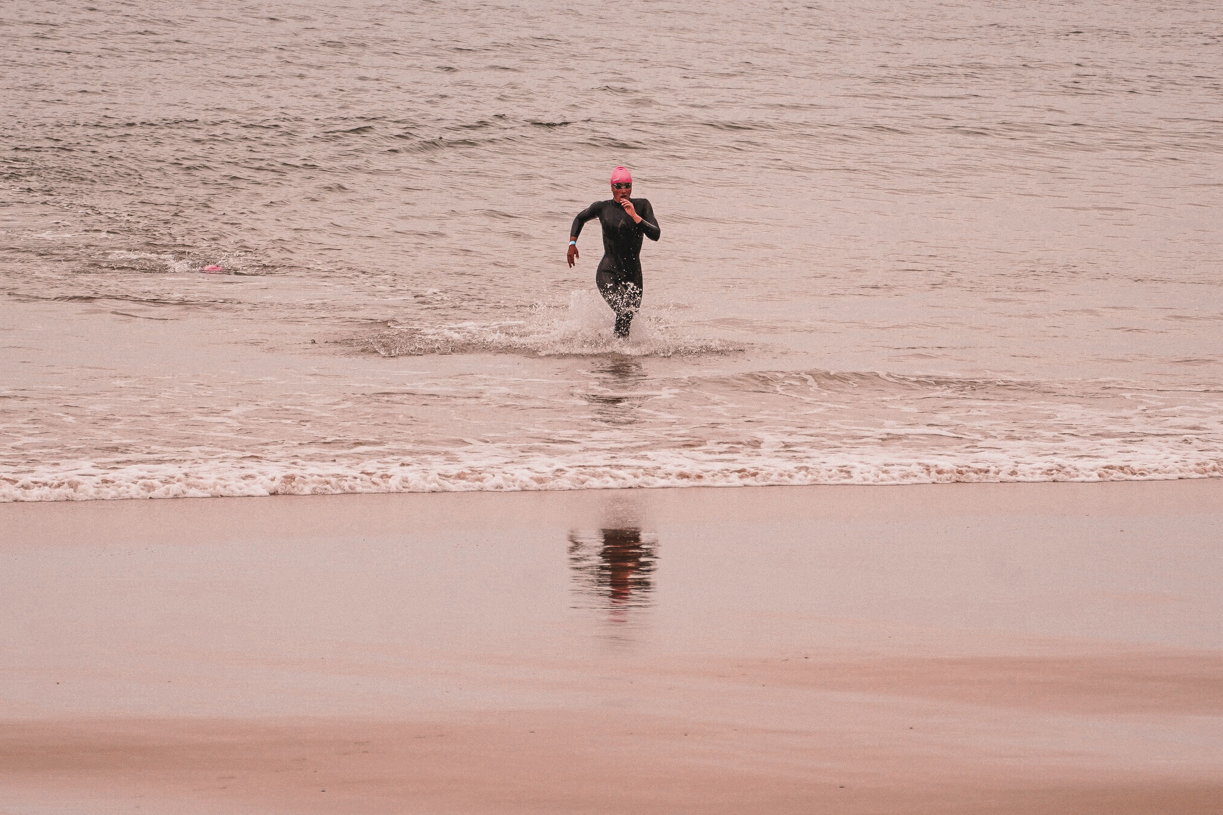 Triathlete Running Out of Ocean at Dawn · Free Stock Photo