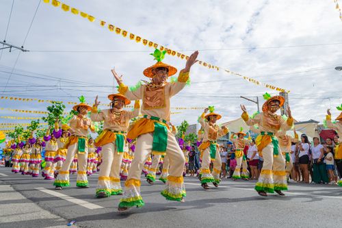Free Vibrant festival parade in Tarlac City showcasing traditional costumes and dance. Stock Photo