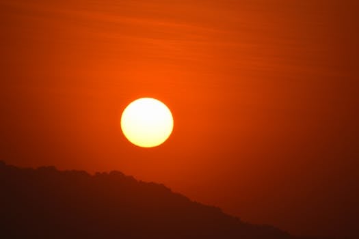 Stunning golden sunrise over the horizon in Mumbai, India. Vibrant orange hues fill the sky.