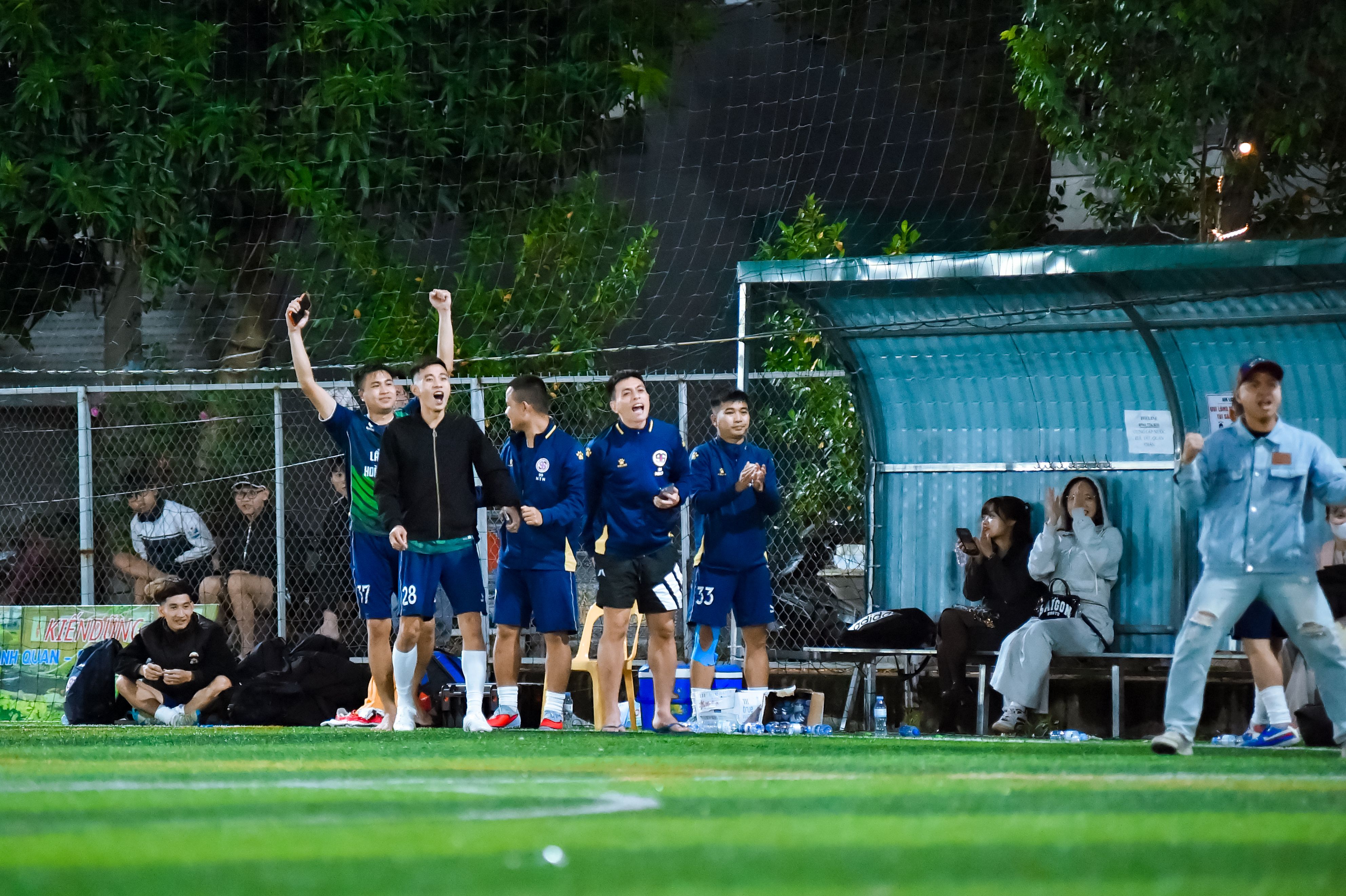 Excited Football Team Celebrating Victory in Hà Nội