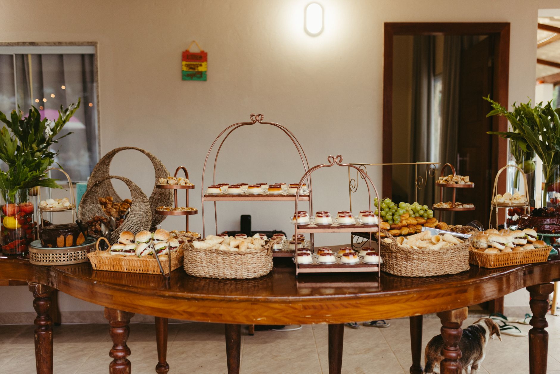 A beautifully arranged buffet with assorted pastries, breads, and fresh fruits in a sophisticated indoor setting.