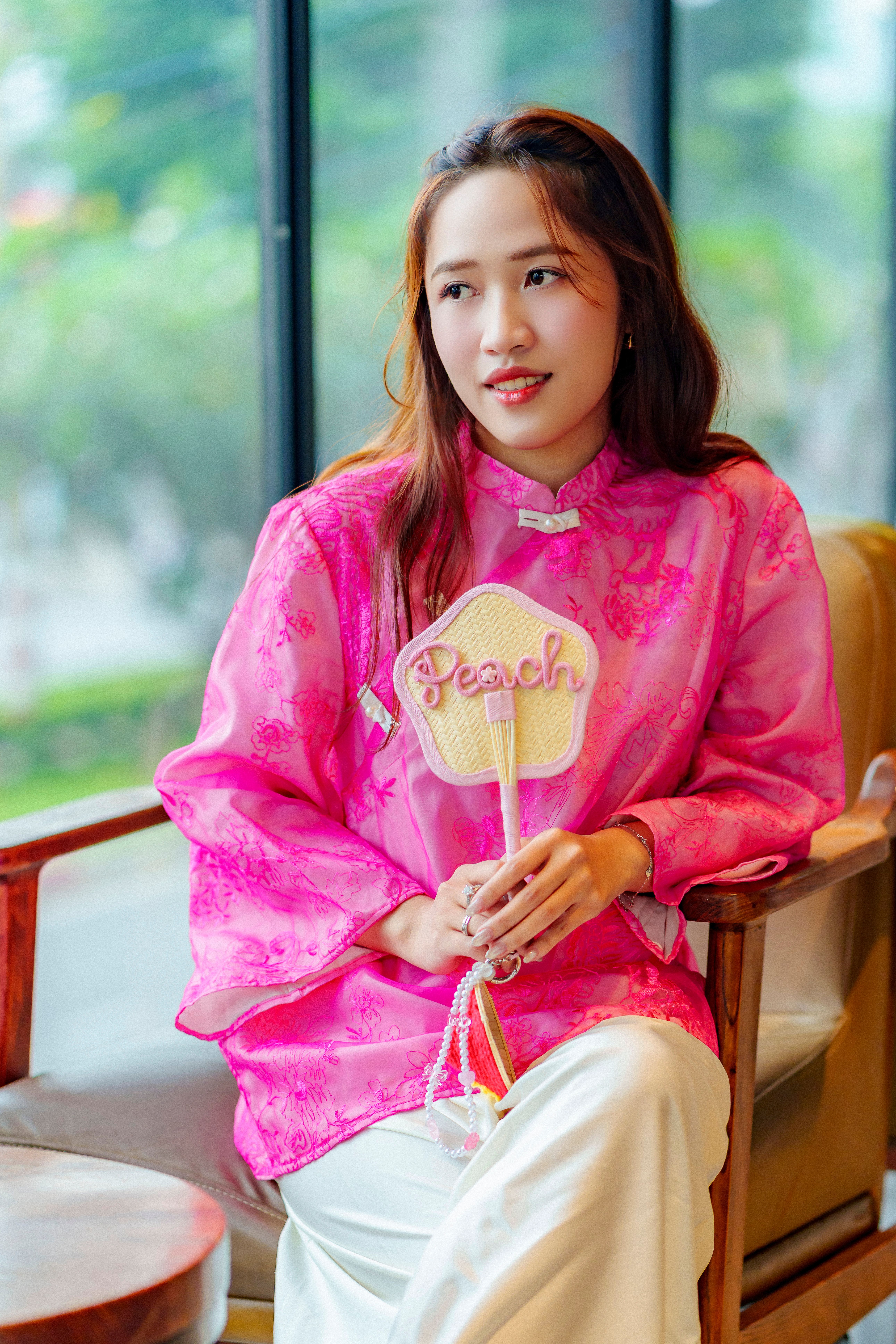 Young Woman in Pink Traditional Vietnamese Ao Dai