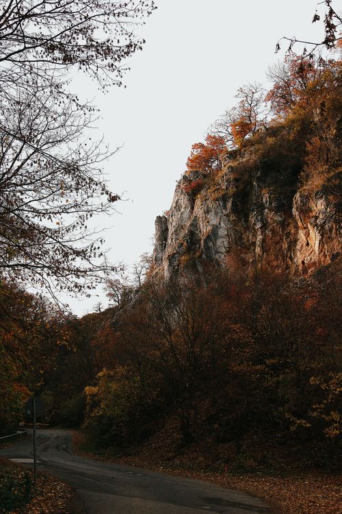 Free Beautiful autumn landscape of a cliffside with colorful foliage in Hungary. Stock Photo