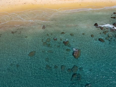 Stunning aerial view of Glyfada Beach in Greece, showcasing its azure waters and sandy shores.