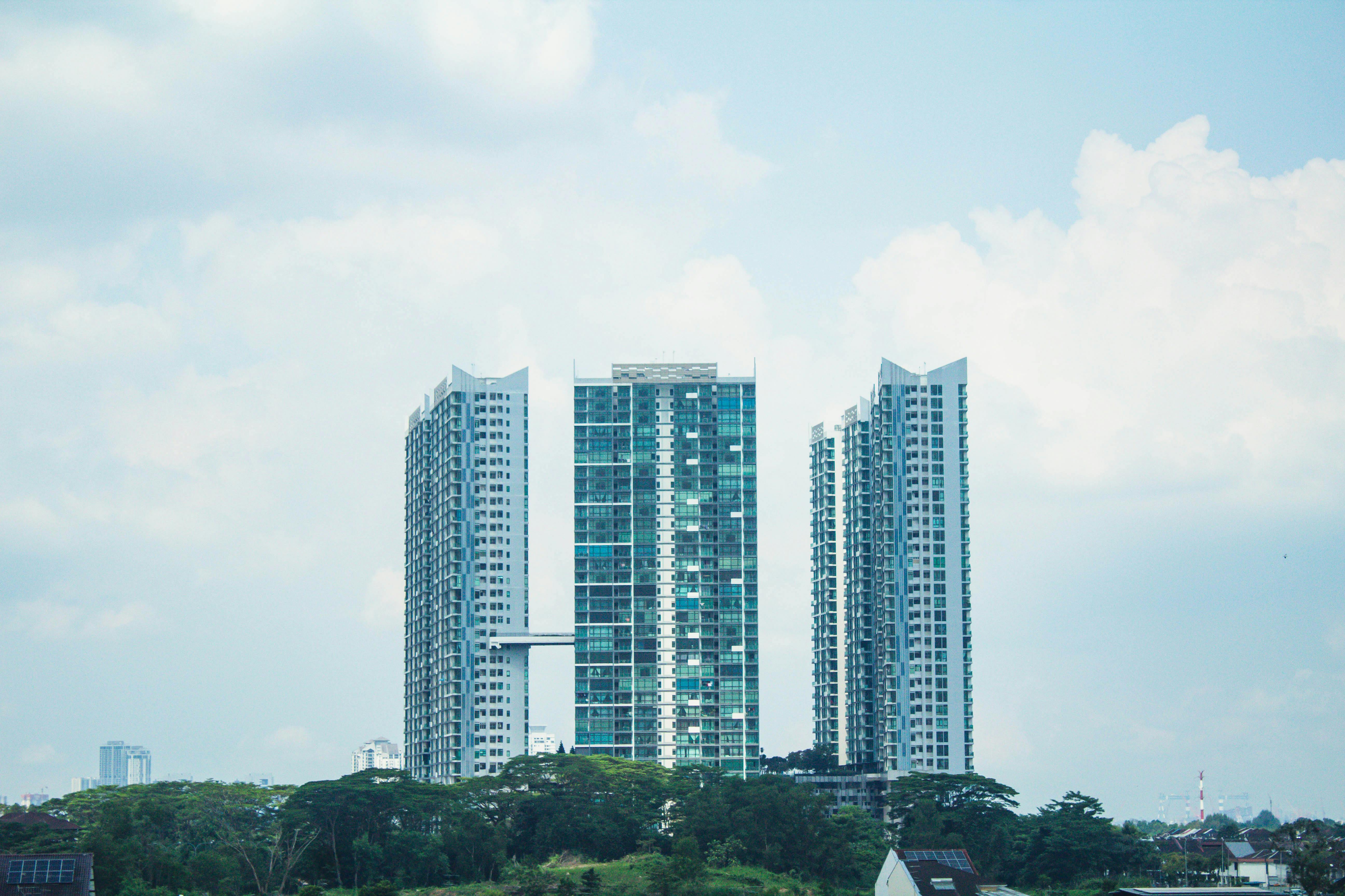 Contemporary architectural high-rises under a bright sky in Johor Bahru, Malaysia.