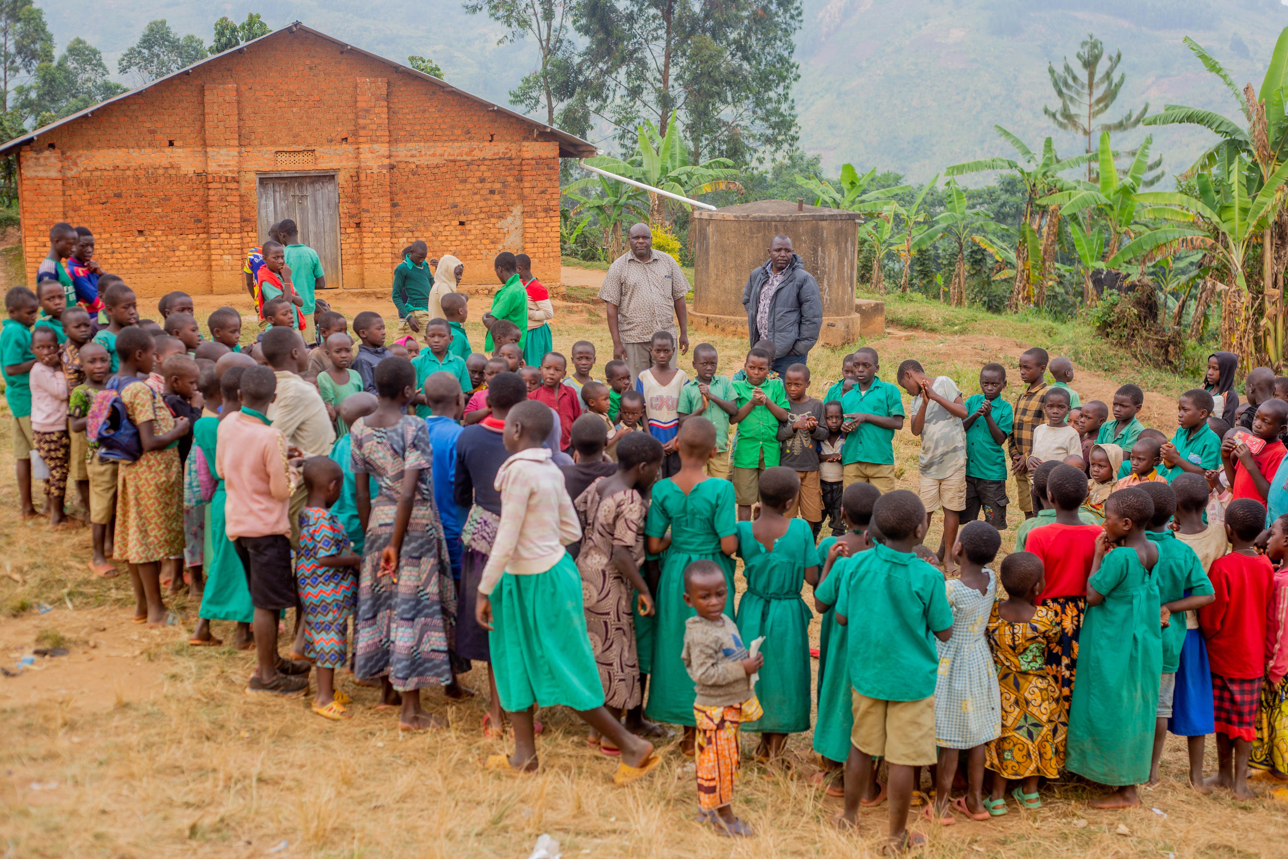 Children Gathering in Rural African Village Schoolyard · Free Stock Photo