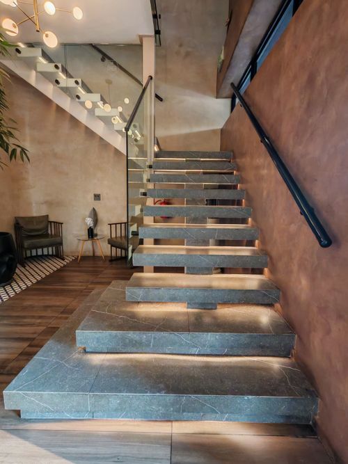 Free A stylish indoor staircase made of stone, located in a contemporary home in Krugersdorp, South Africa. Stock Photo