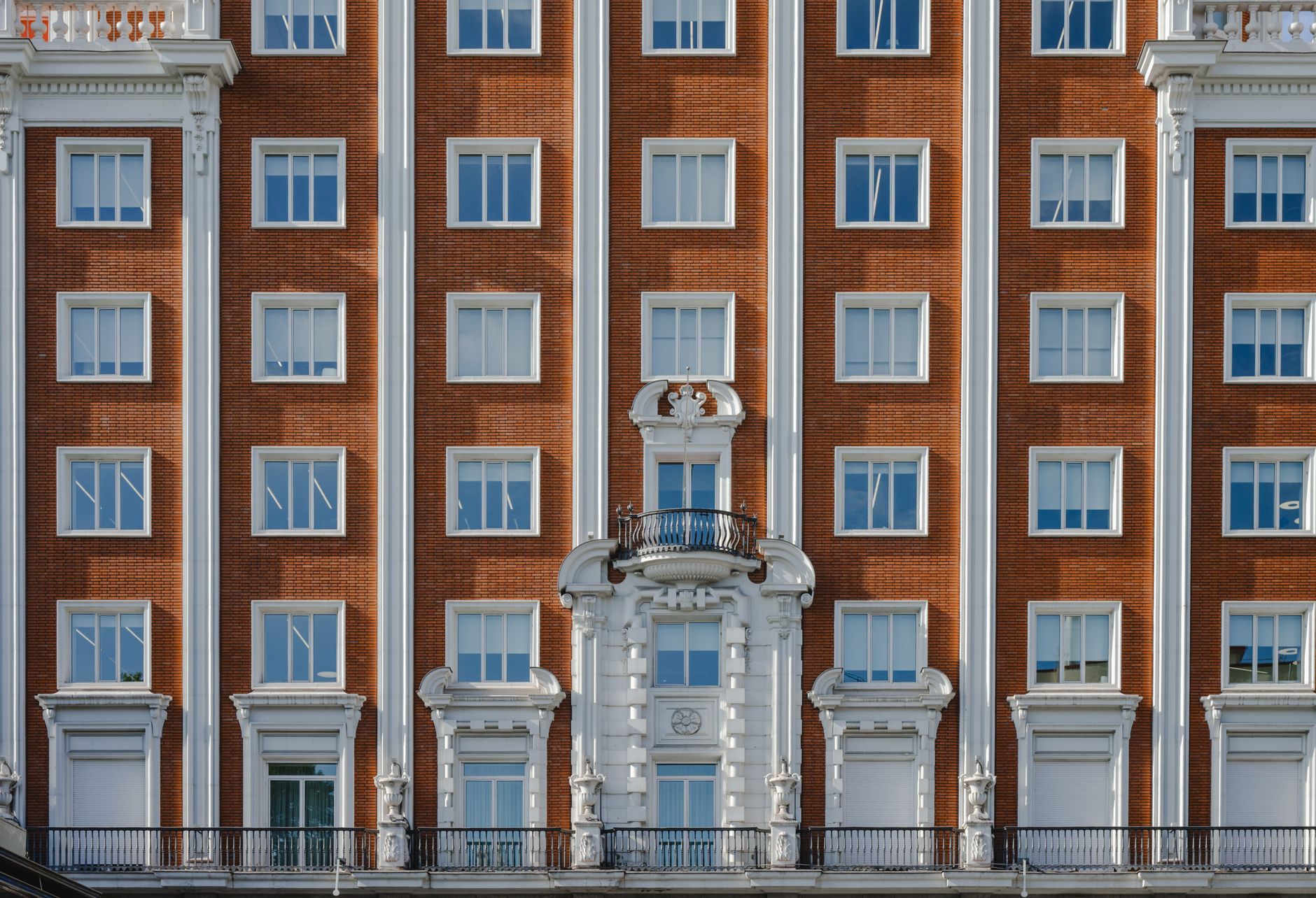 Detailed shot of a historic red brick building facade in Madrid, Spain.