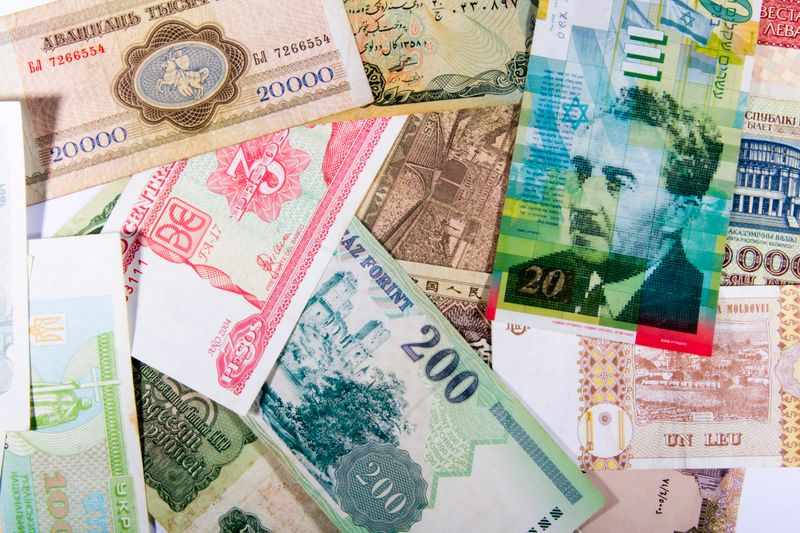 International banknotes arranged in a flat lay — photo by Valentin Ivantsov on Pexels
