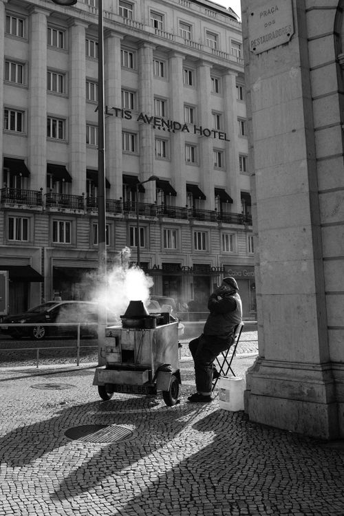 Free Black and white photo of a street vendor by Altis Avenida Hotel, Lisbon. Stock Photo