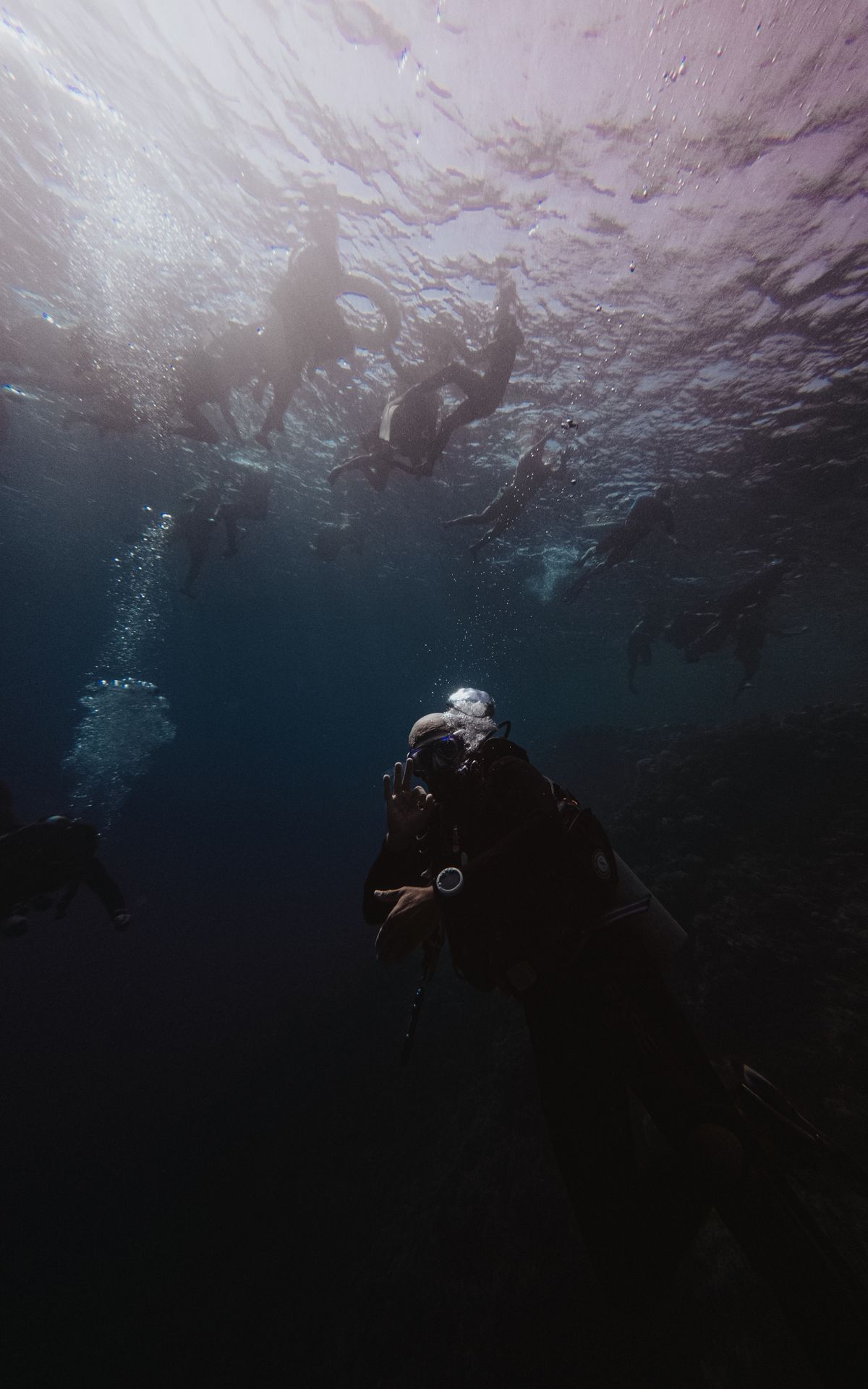 Divers exploring the deep blue ocean
