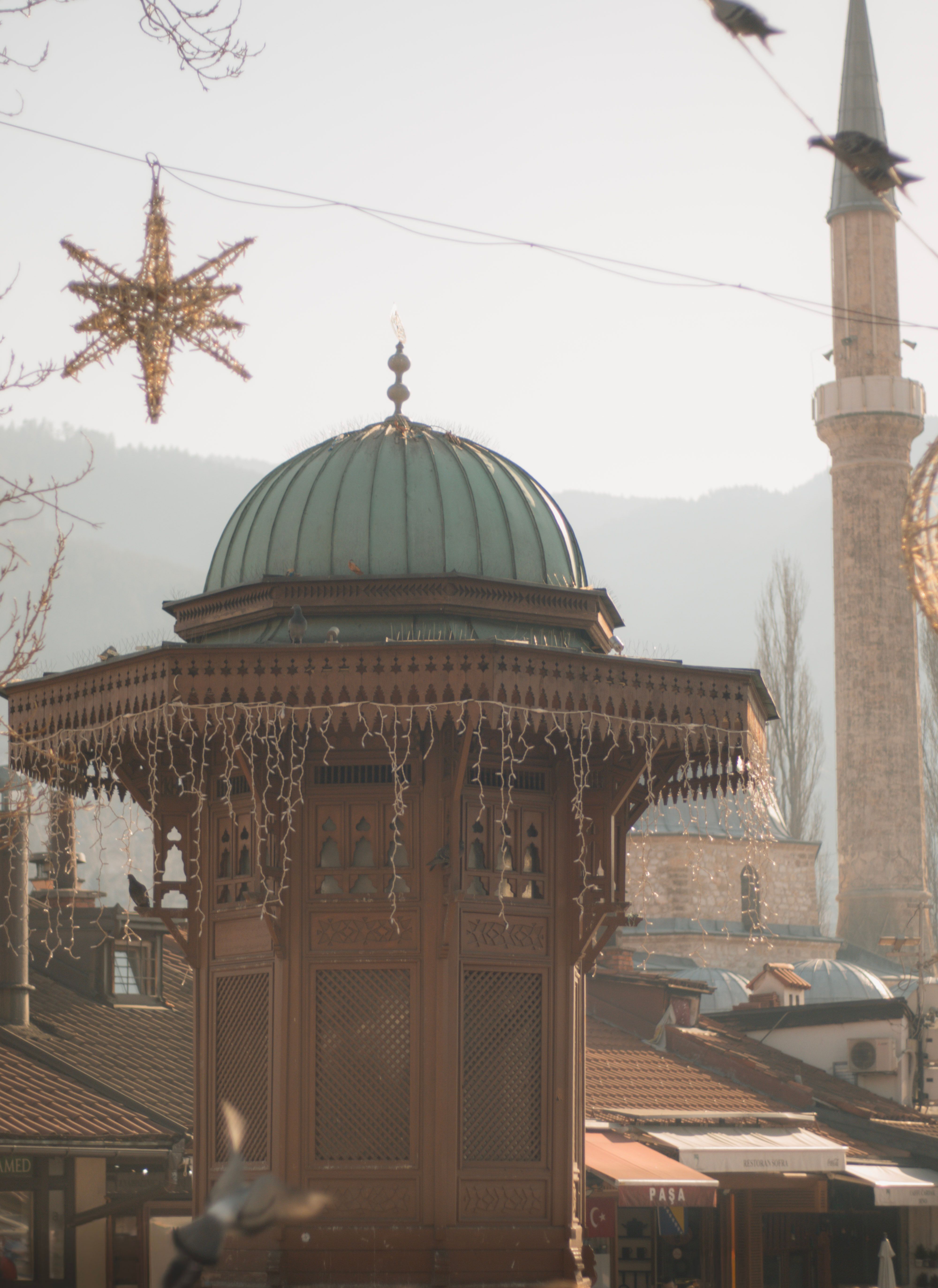 Iconic Sebilj Fountain in Sarajevo's Winter Glow · Free Stock Photo