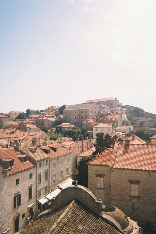 Free Aerial view of Dubrovnik's historic red-roofed buildings under a clear sky. Stock Photo
