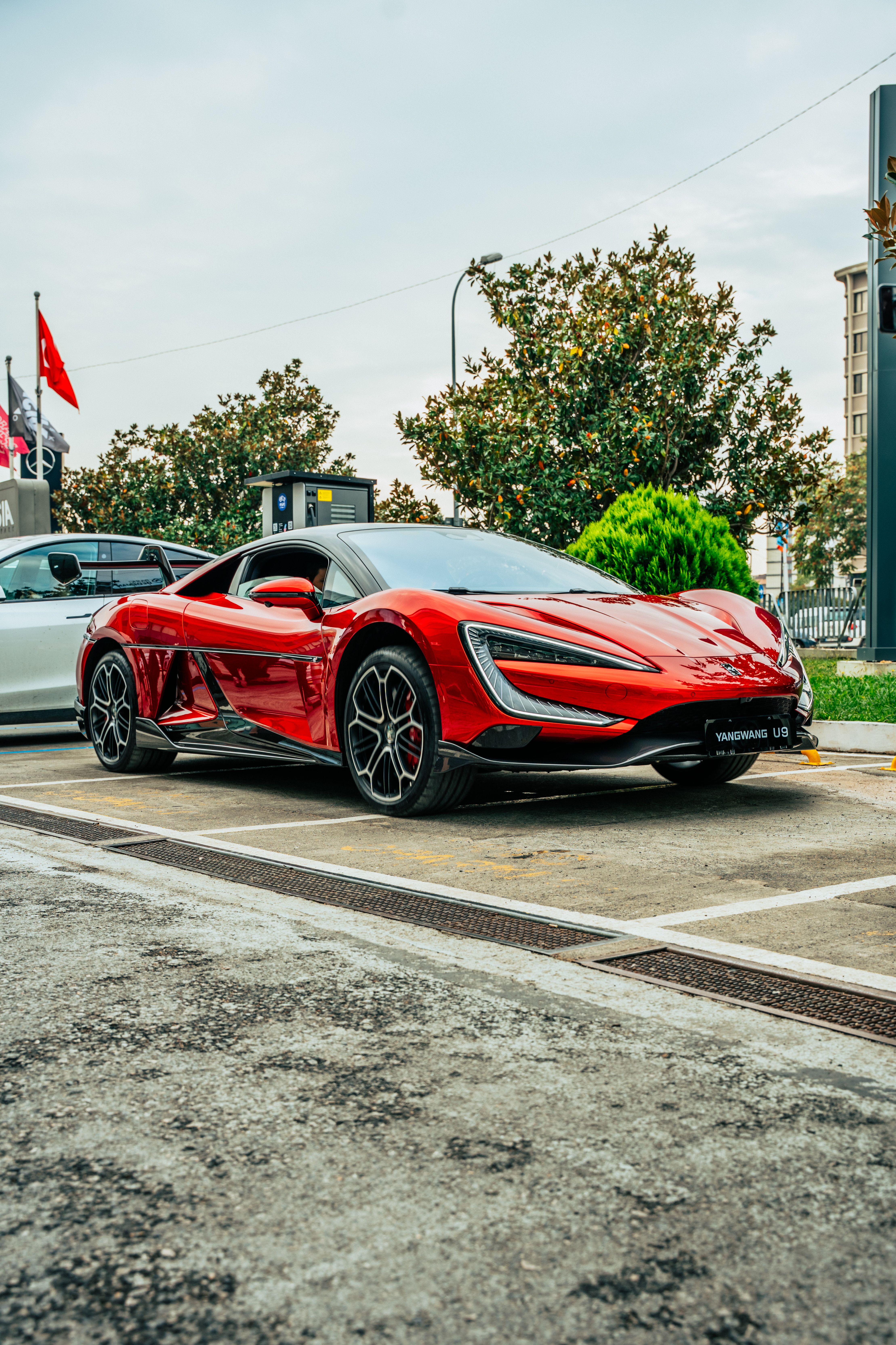 Sleek Red Sports Car on a City Street · Free Stock Photo