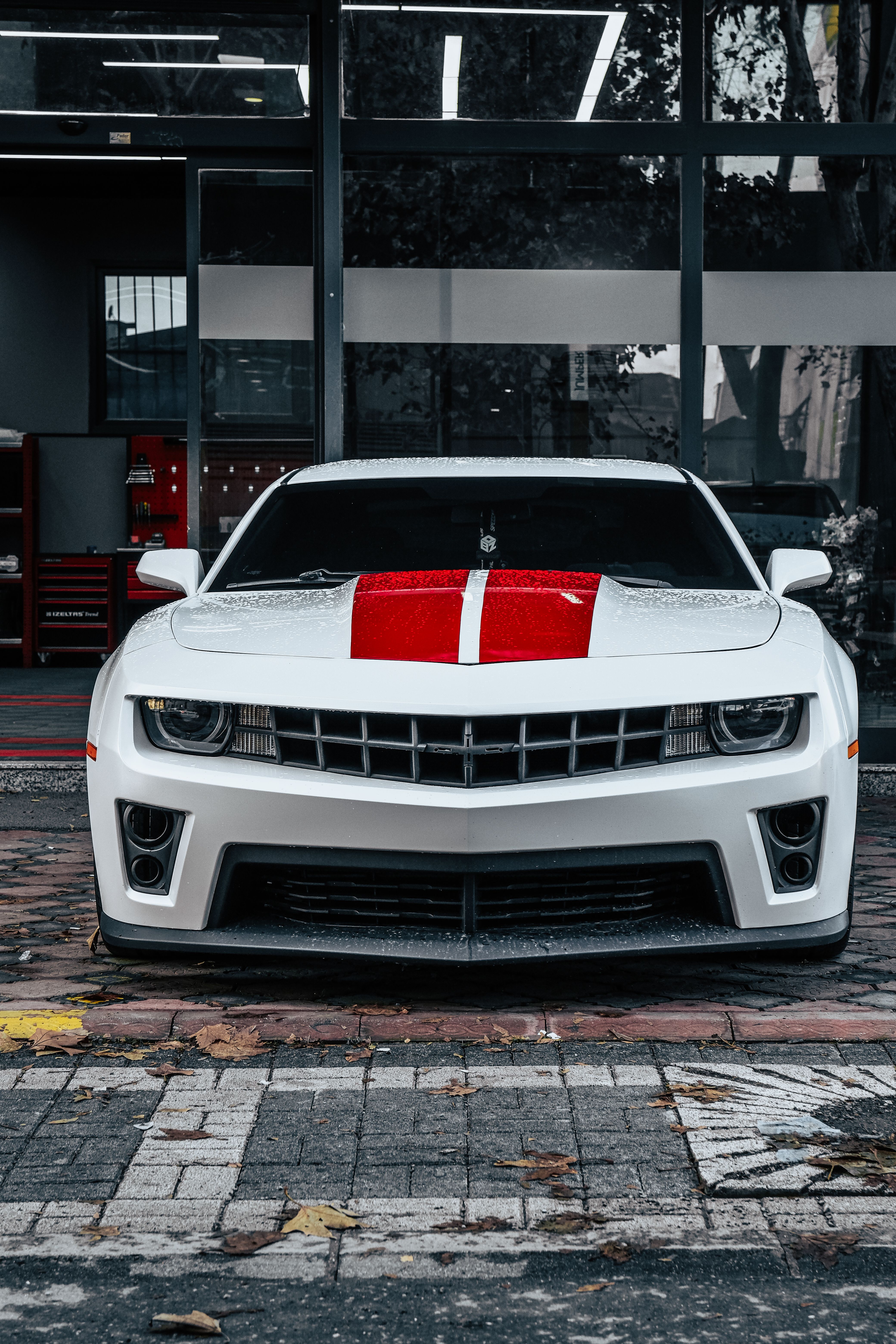 White Sports Car with Red Stripe Front View · Free Stock Photo