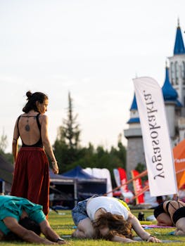 Group practicing yoga outdoors in Eskişehir with scenic park view.