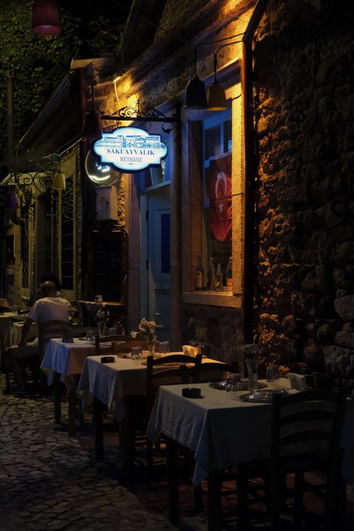 Free Ambient outdoor dining scene with a historic vibe in dim light. Stock Photo