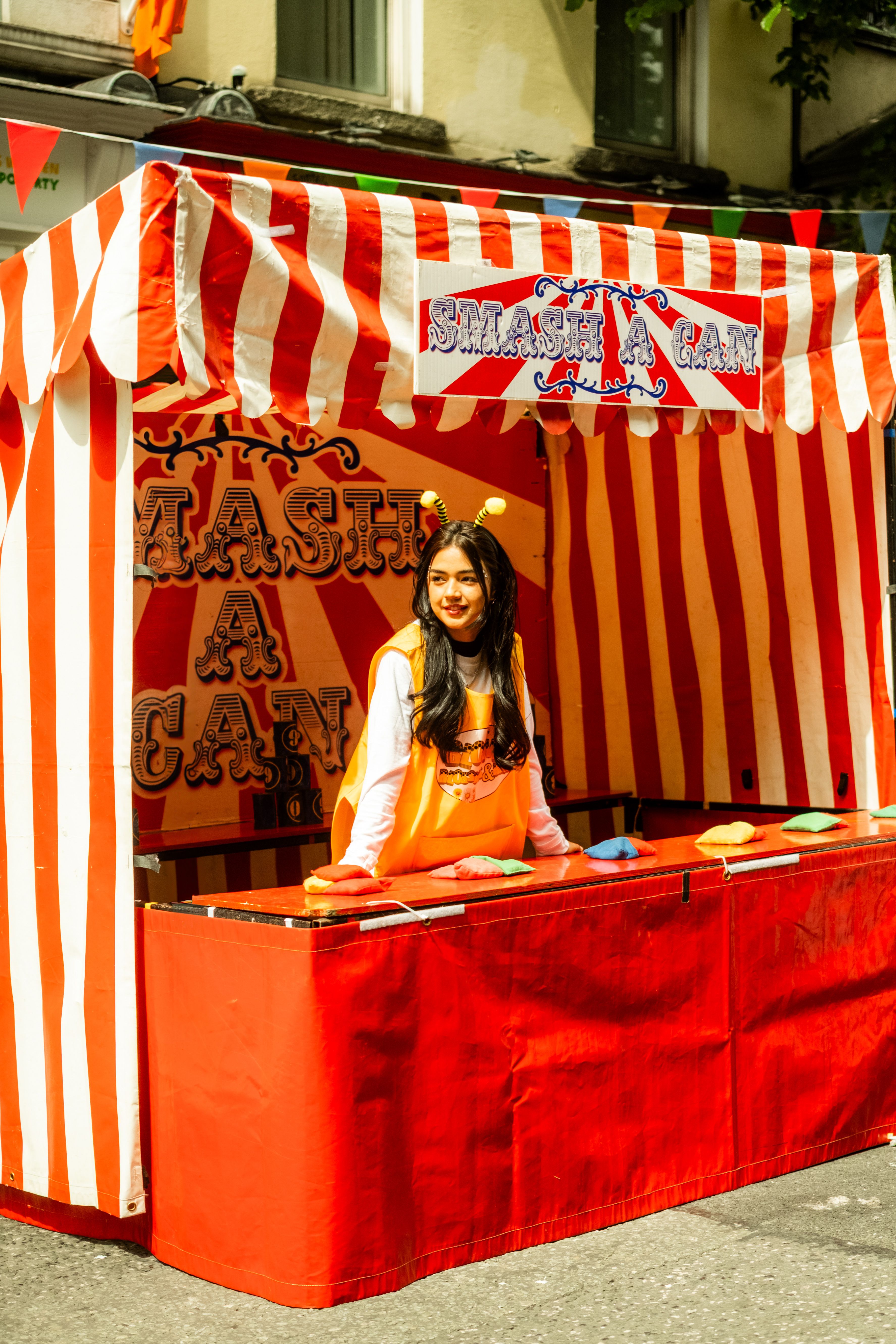 Colorful Carnival Game Booth with Striped Tent